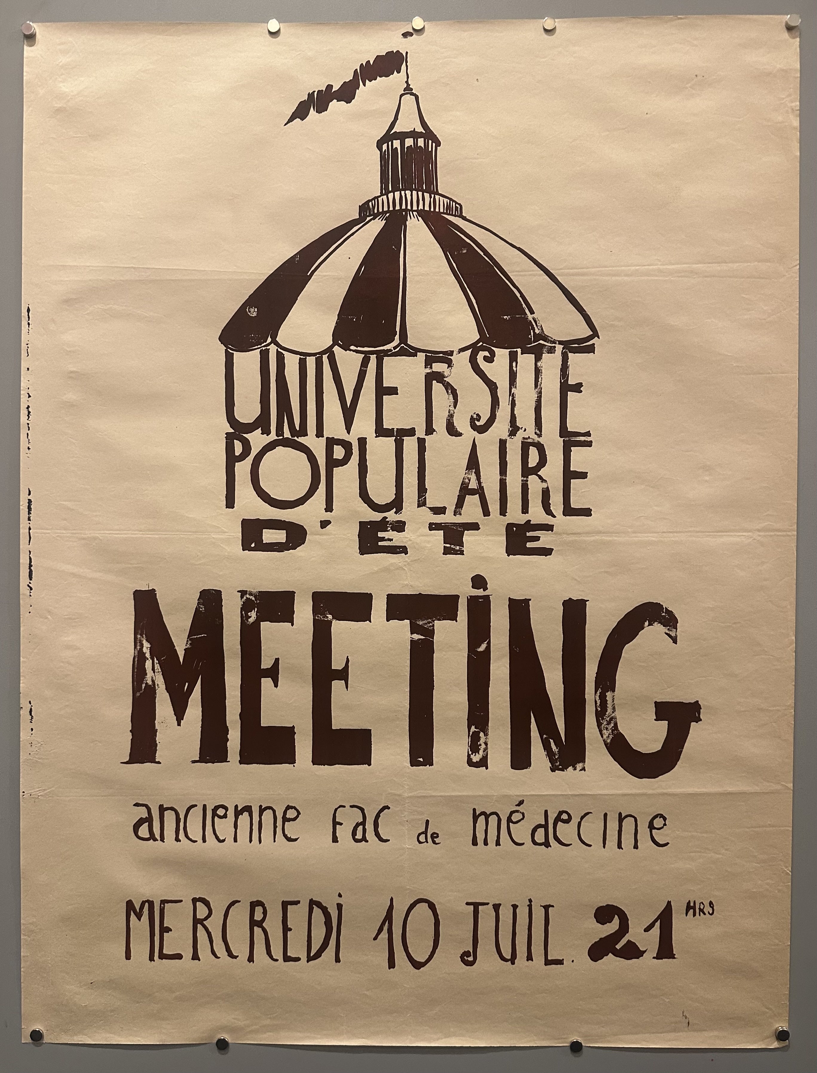 A tent top covers the text calling for a meeting at a University in this May 68 propaganda poster.