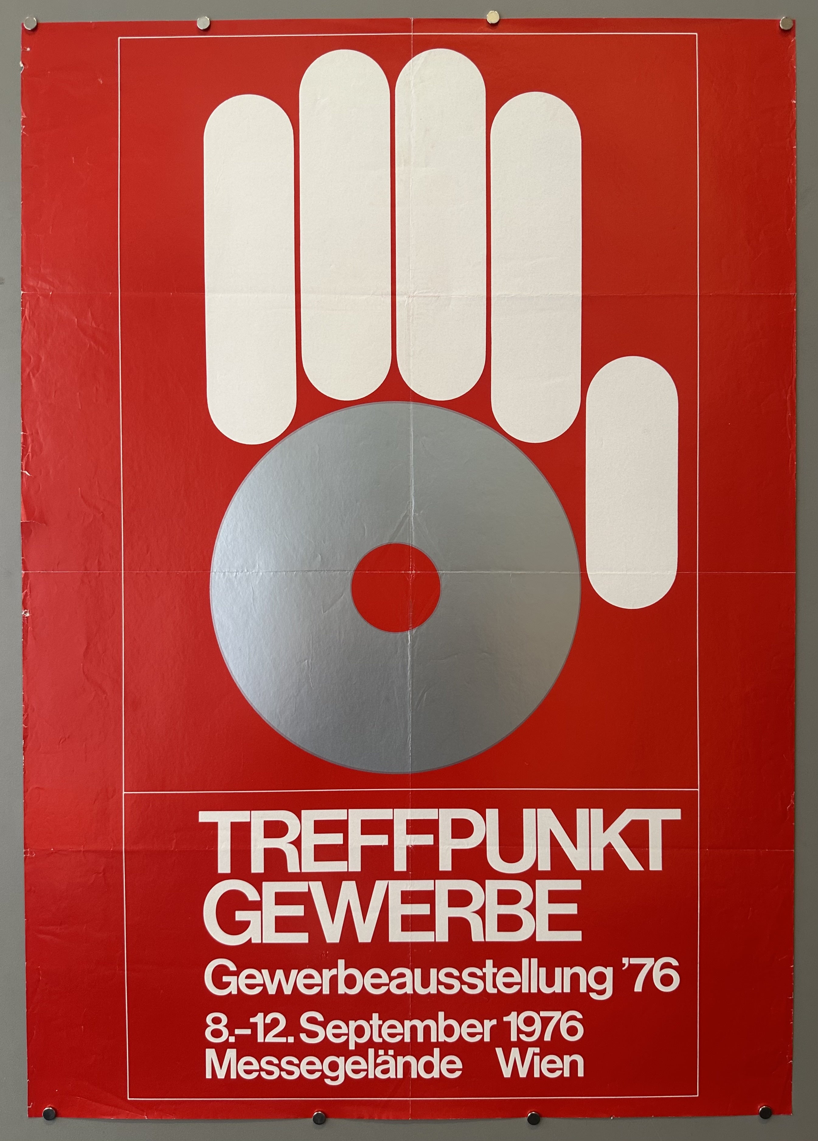 This poster advertises "Treffpunkt Gewerbe," which was a trade exhibition held in Vienna, Austria, in 1976.