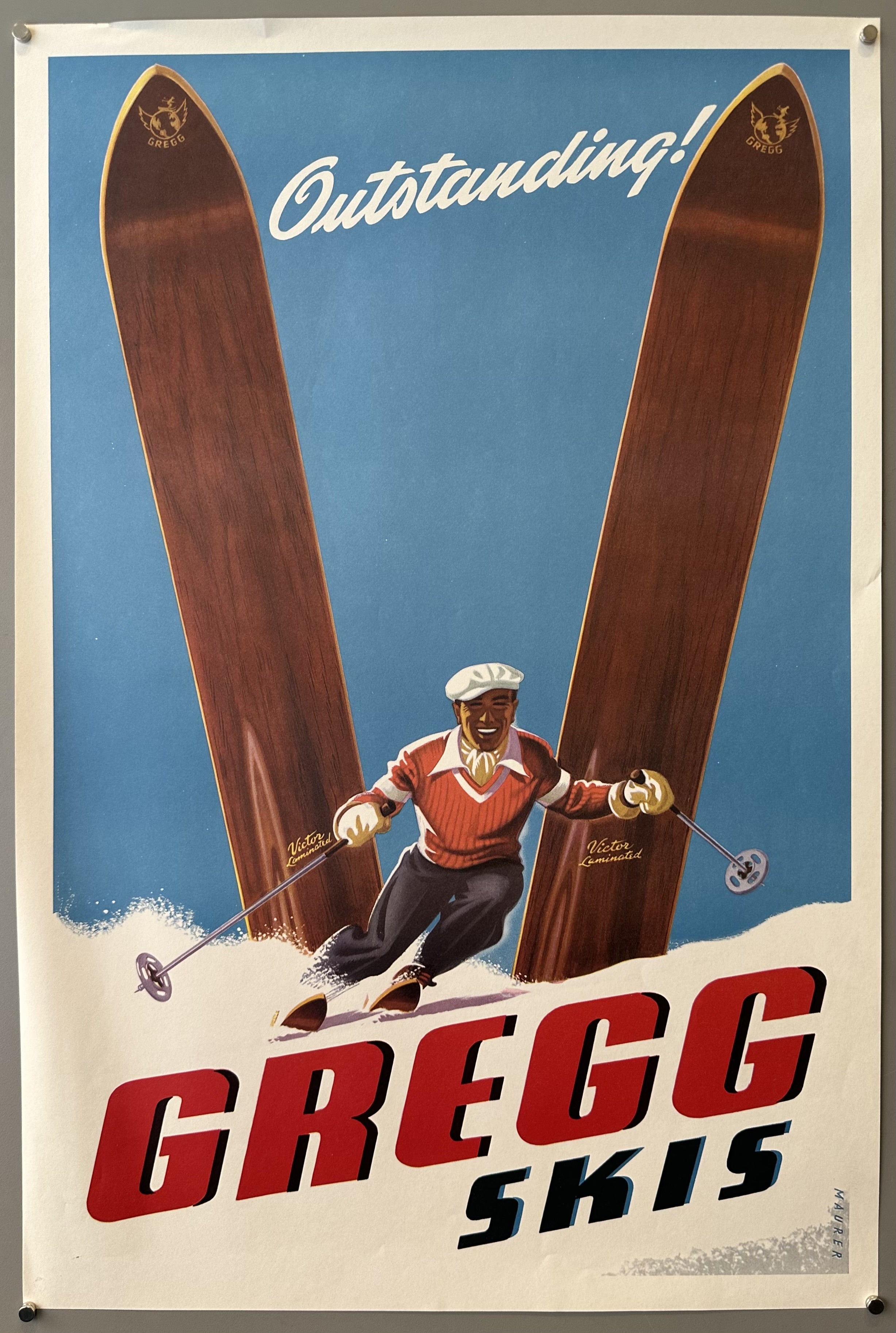 Poster with illustration of man skiing downhill against blue sky with Gregg skis sticking out of the snow.