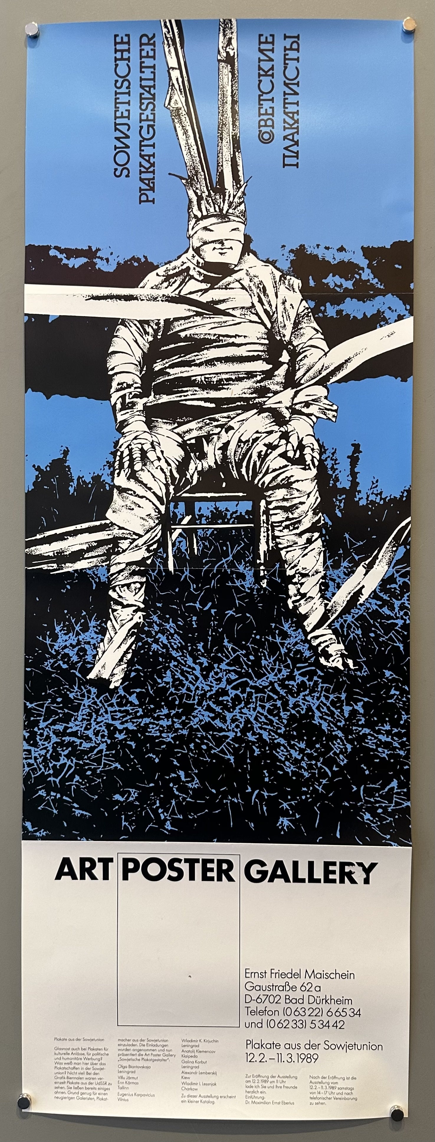 Narrow poster with illustration of a man wrapped in white cloth in a chair for a German art gallery's exhibition of USSR artists.