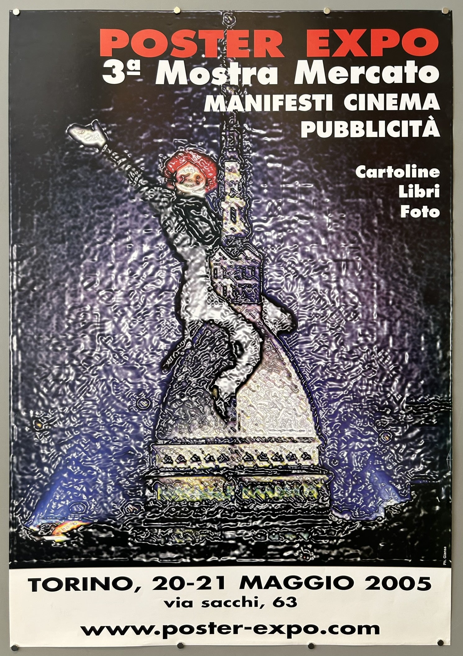 The poster explicitly states "TORINO," which is the Italian name for the city of Turin, located in Italy. Additionally, the text "3ª Mostra Mercato MANIFESTI CINEMA PUBBLICITÀ"