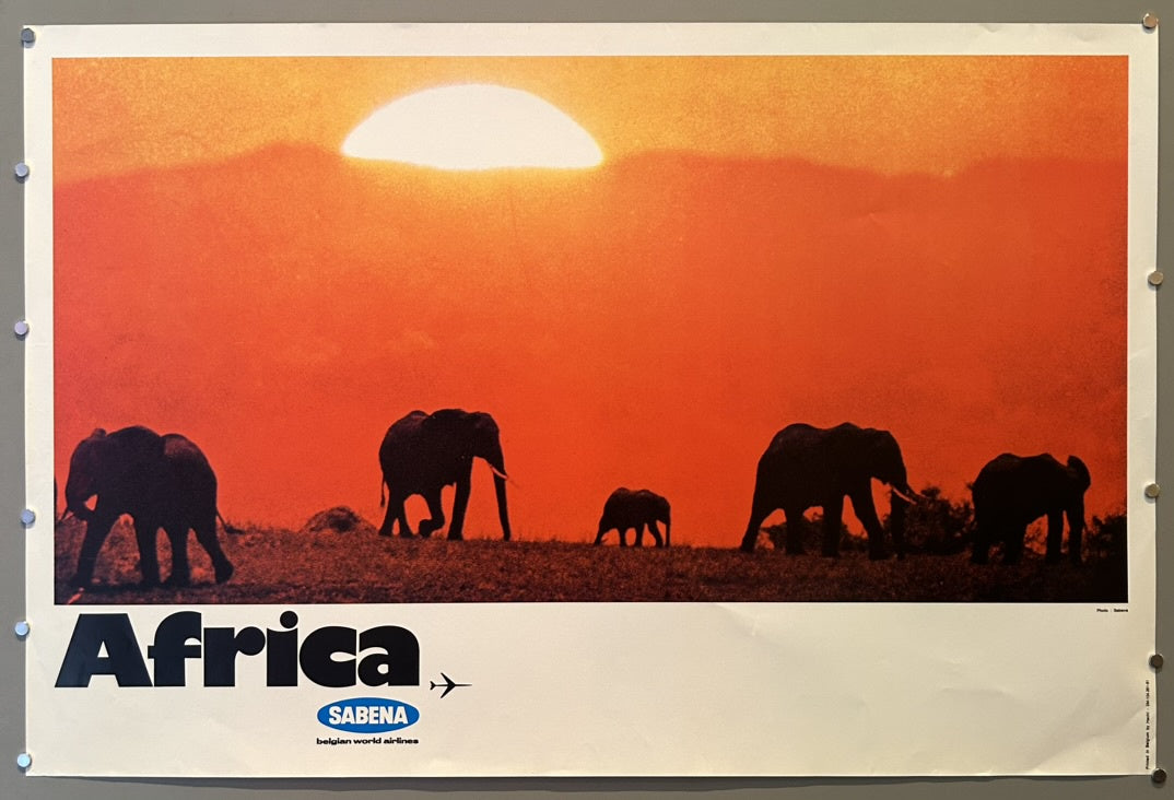 This vintage travel poster, featuring elephants silhouetted against a sunset, was created for Sabena Belgian World Airlines to promote travel to Africa. While some similar Sabena posters are dated around 1959 or 1960, this specific "Africa" design is consistently attributed to 1968 in various sources.
