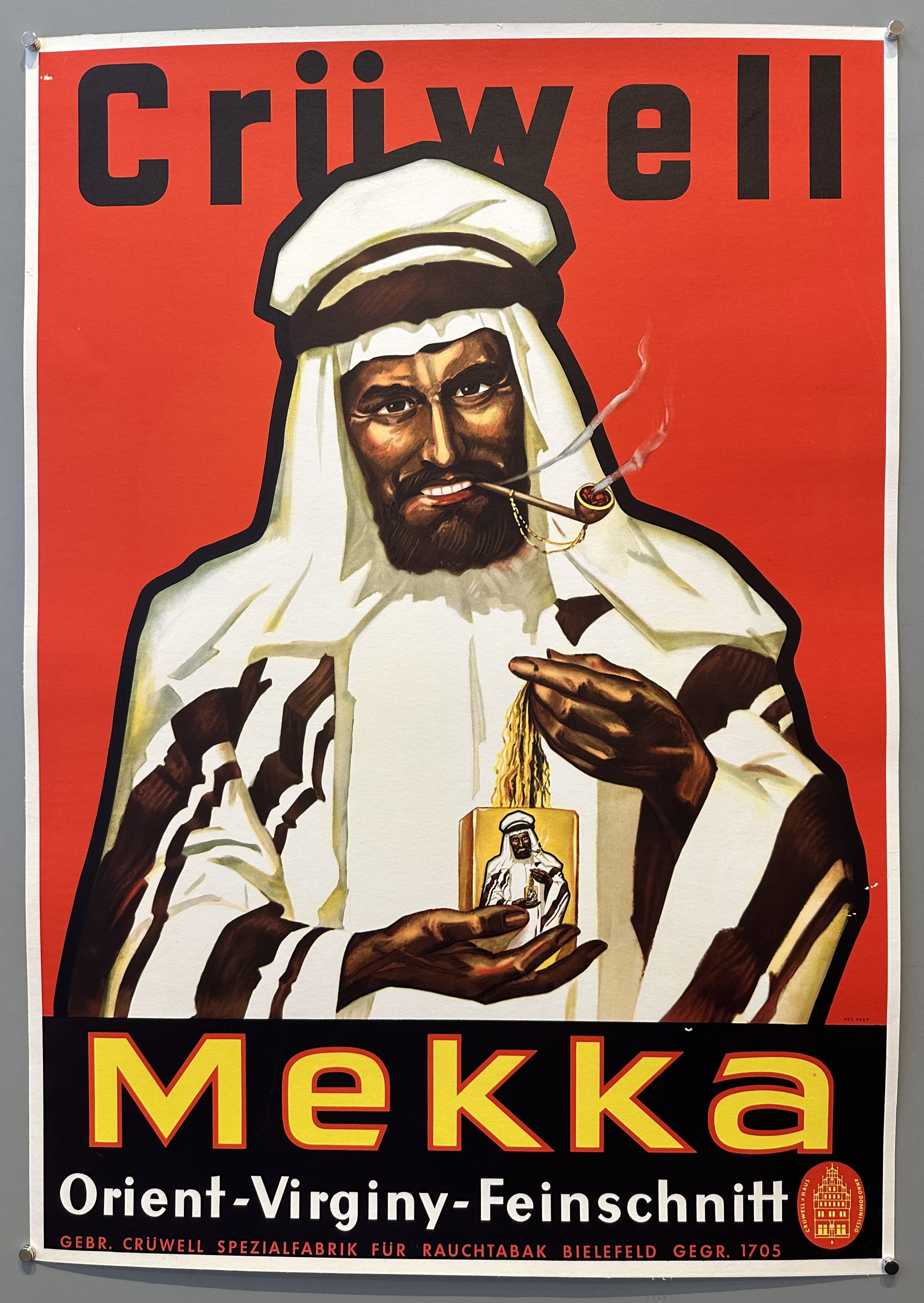 Illustrating of a man dressed in traditional Middle eastern attire holding a tobacco tin with an image of himself on it.