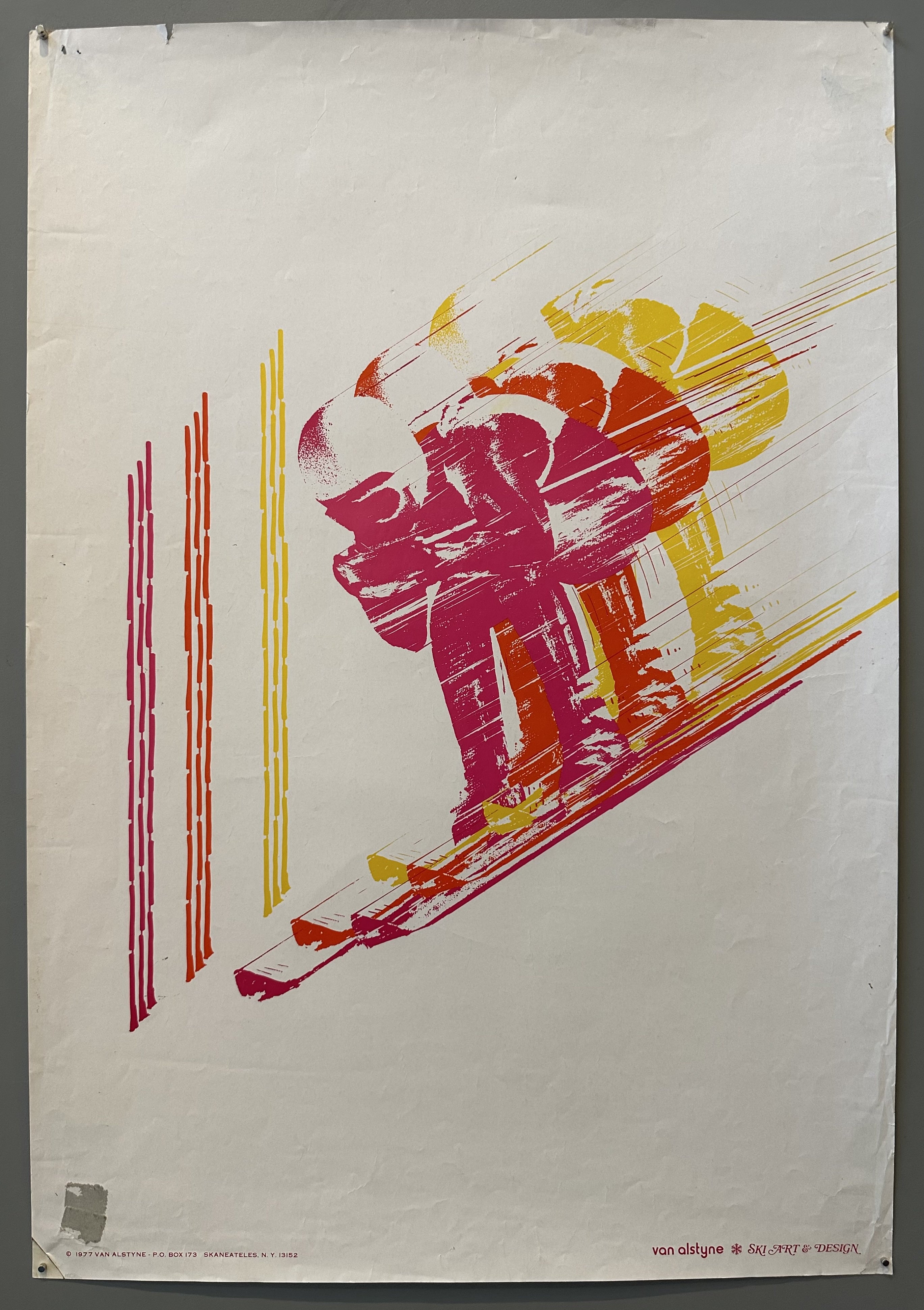 Pink, orange, yellow skier.