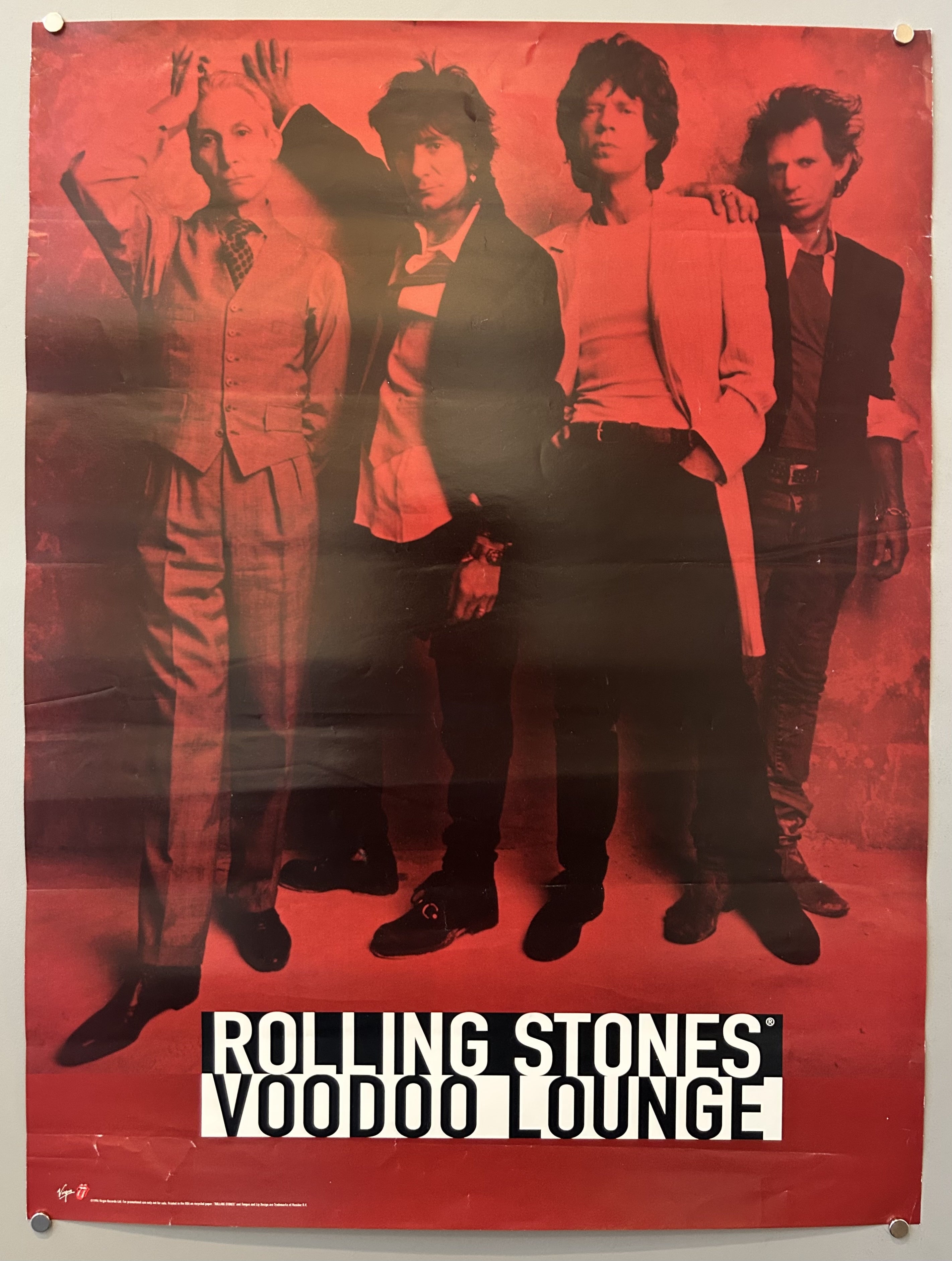 men stand against a wall