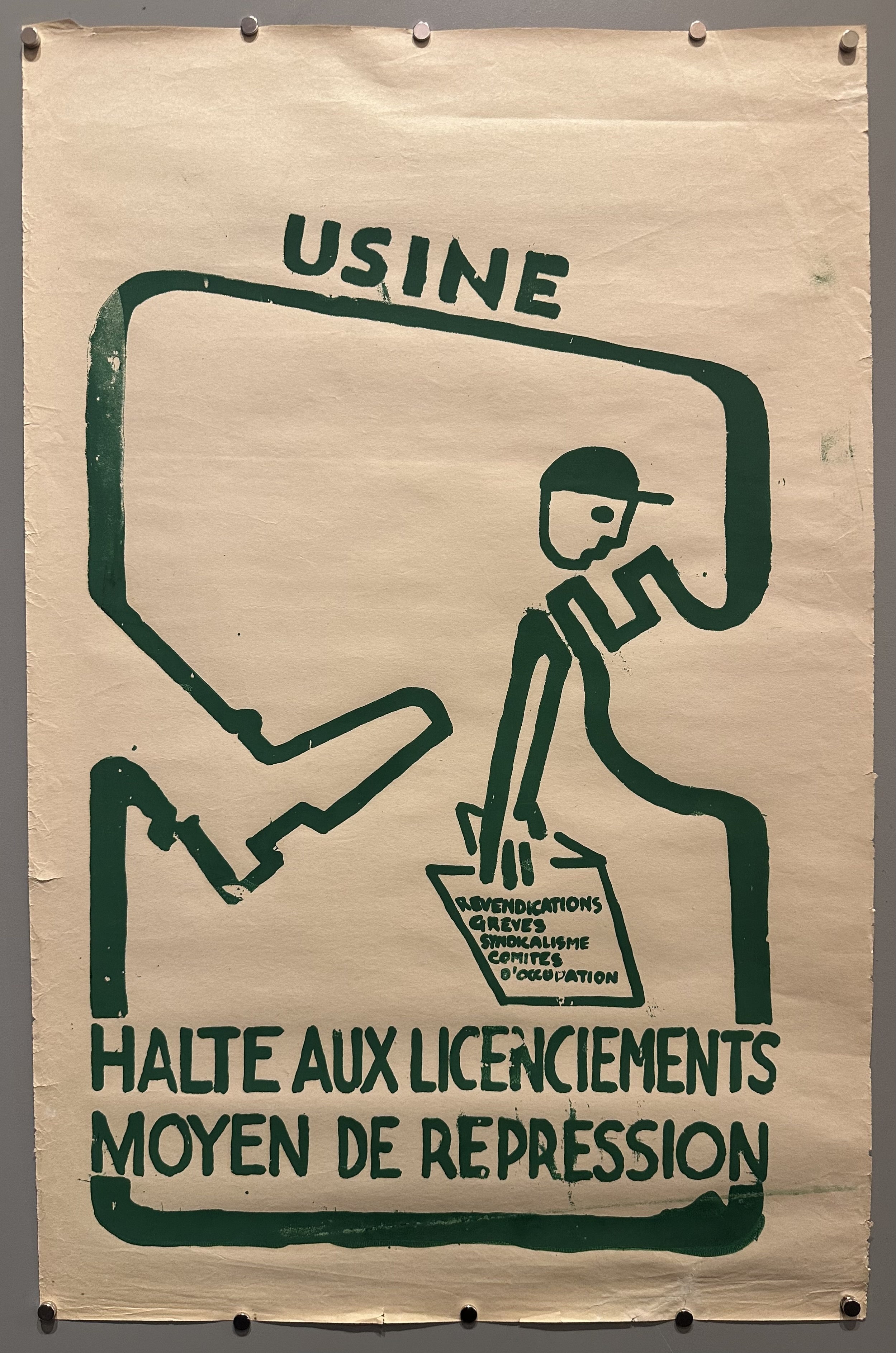 Abstract figure pictured as a 'cog in the machine' with text above and below him in Mai 68 poster.
