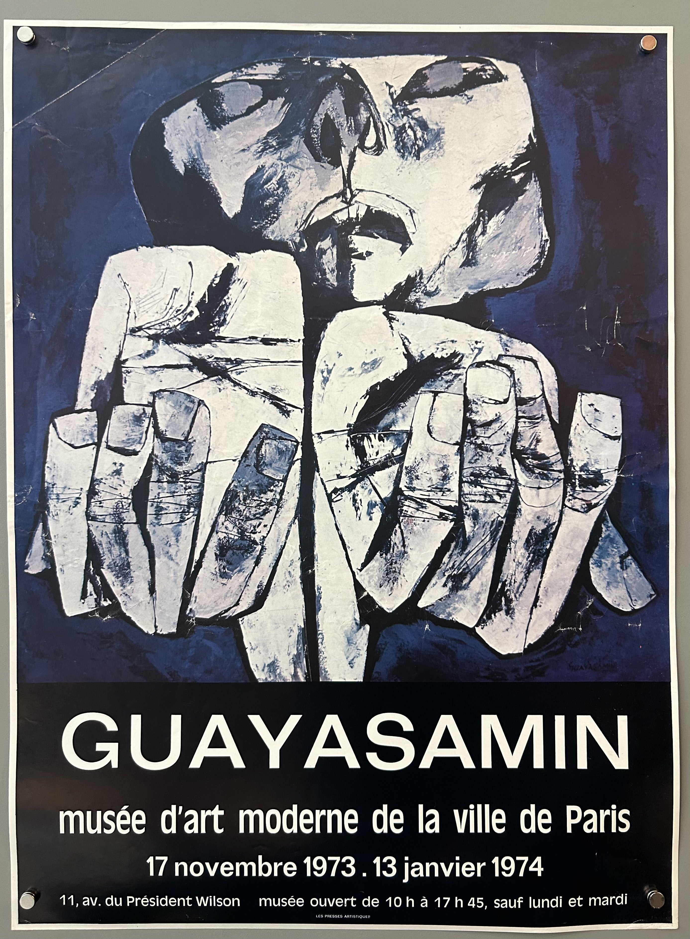 Poster with blue painting of man with hands out by Guayasamin; black border along bottom with white text.