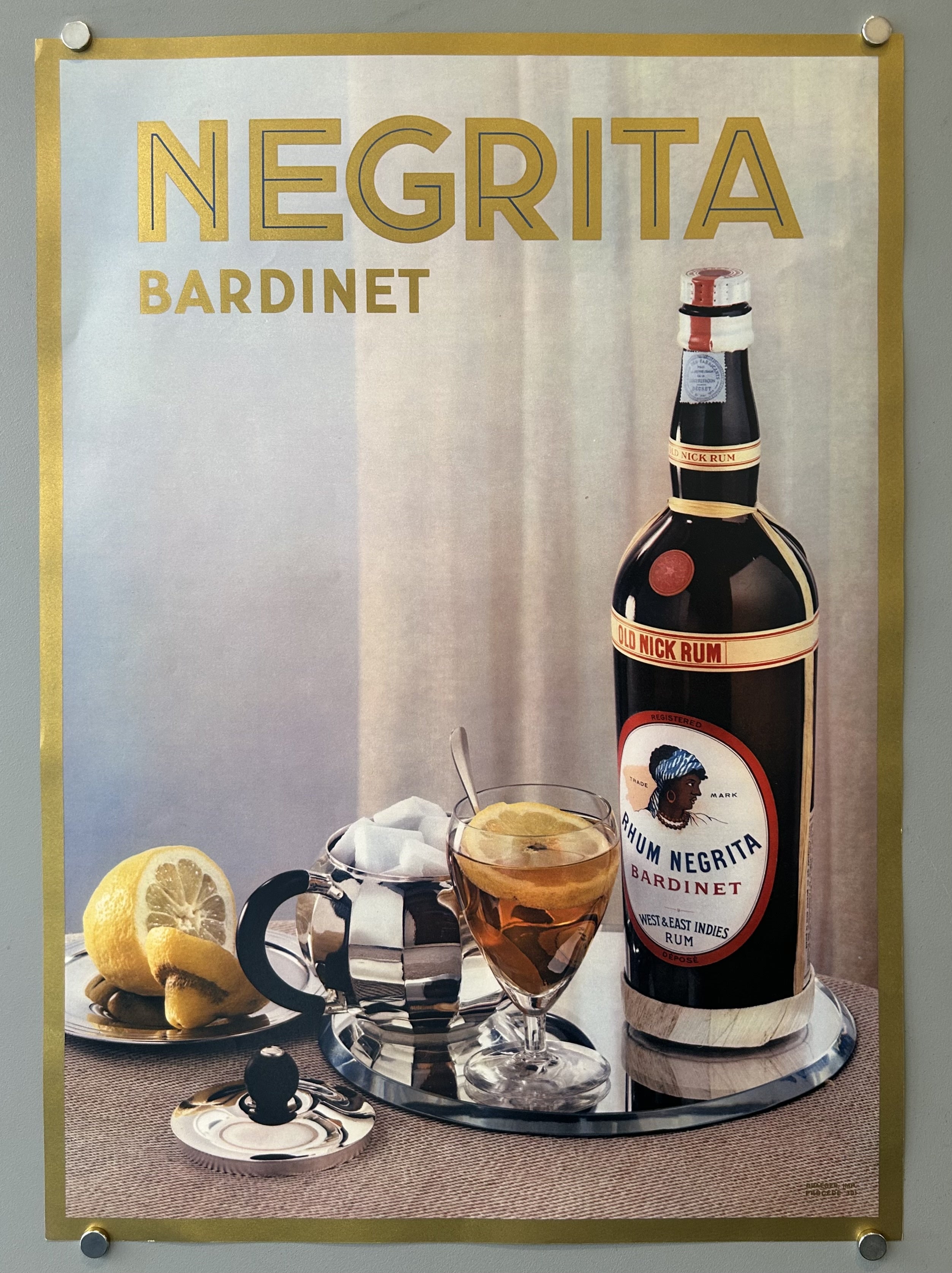 Photo of Negrita Bardinet next to a full glass and lemons in vintage advertisement.