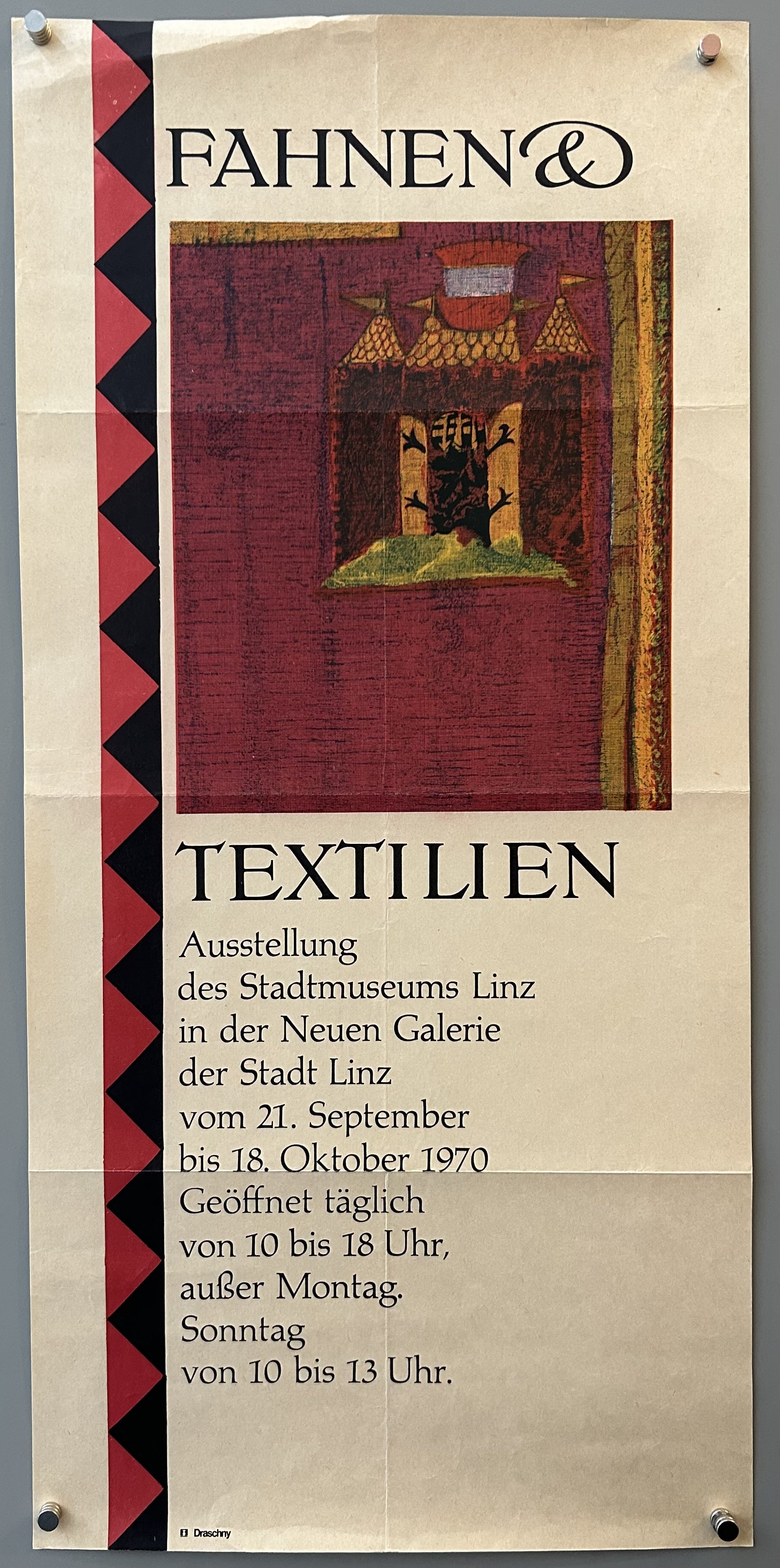 Poster promoting a textile exhibition in Linz with a patch of medieval textile along the top.