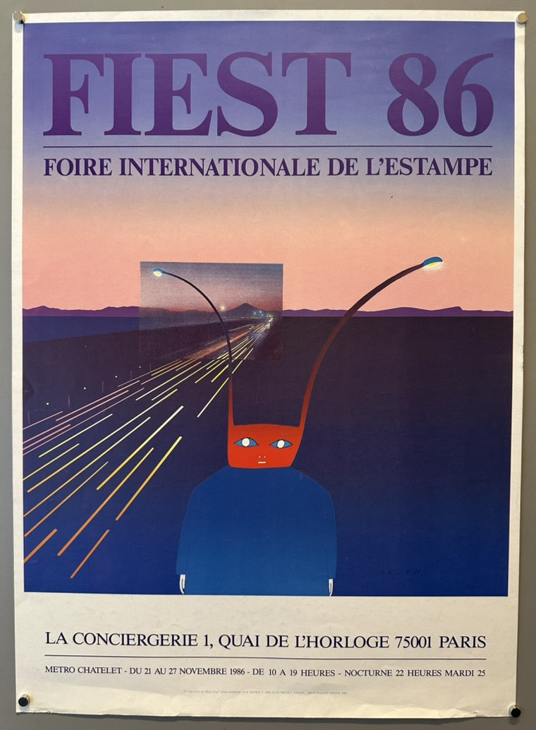 The poster features a surreal image of a red-faced, blue-bodied creature with long, antenna-like projections, set against a semi-realistic highway scene at sunset.