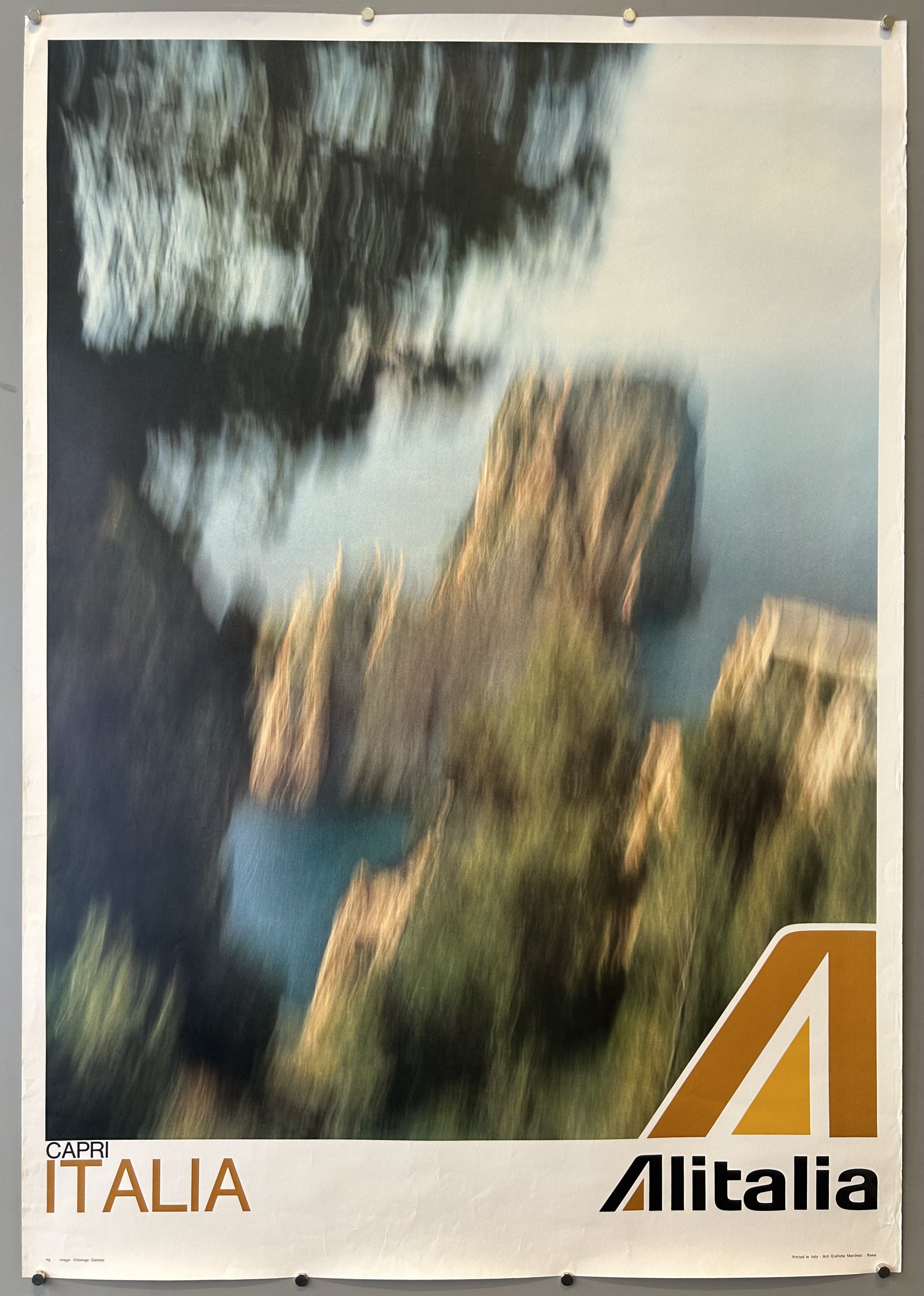 This poster is a vintage travel advertisement for Capri, Italy, by Alitalia, the former national airline of Italy