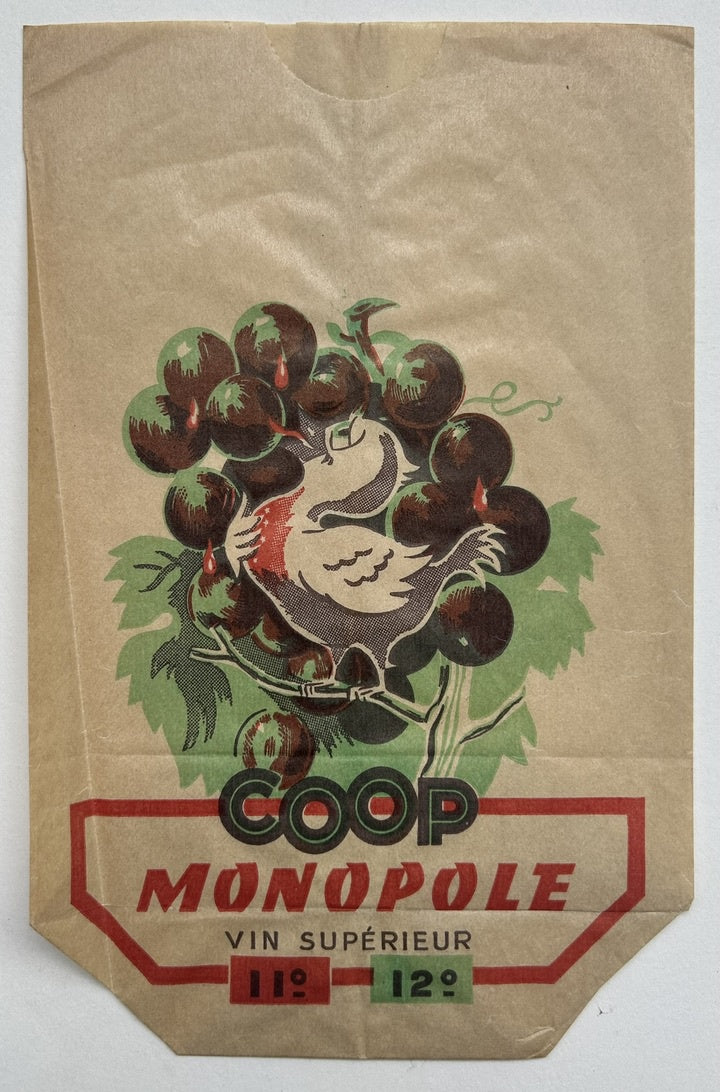 This image shows a vintage paper bag for wine from Coop Monopole, featuring a graphic of a bird nestled among grapes. The text on the bag reads "COOP MONOPOLE VIN SUPÉRIEUR"