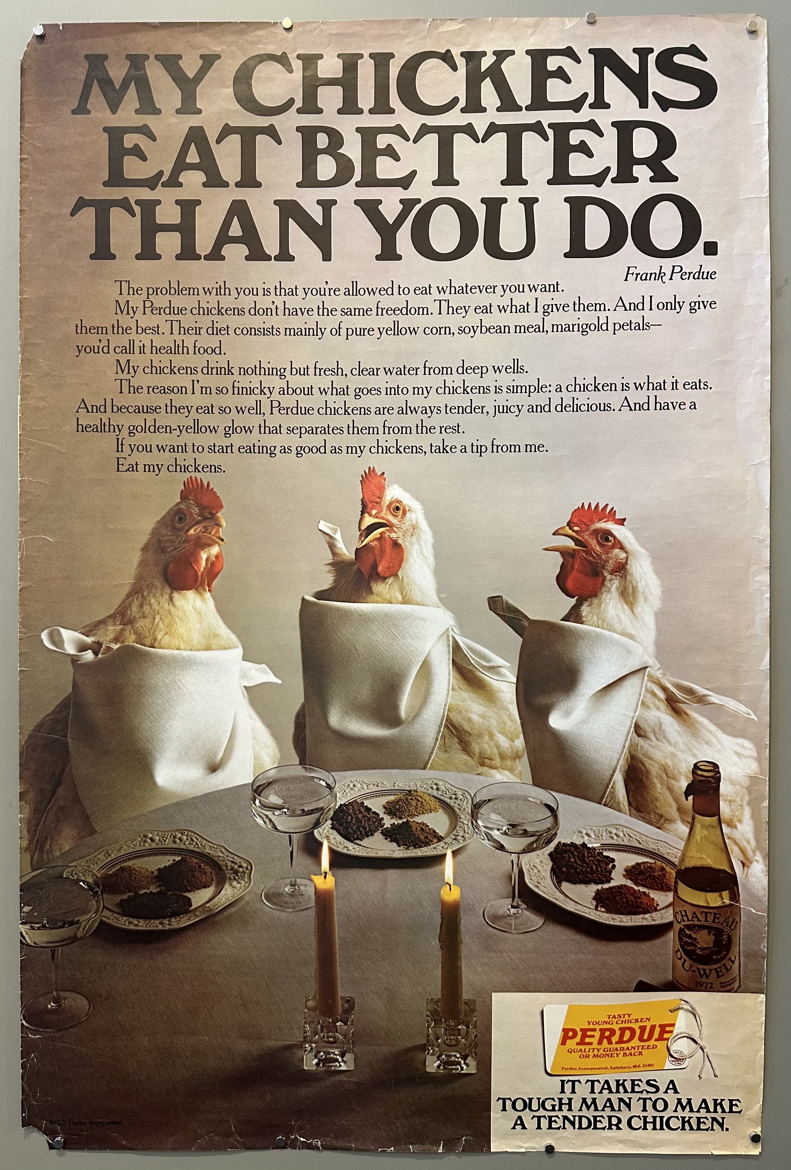 Three chickens sit at a candle-lit tablecloth dinner in this vintage advertisement from Perdue Farms.