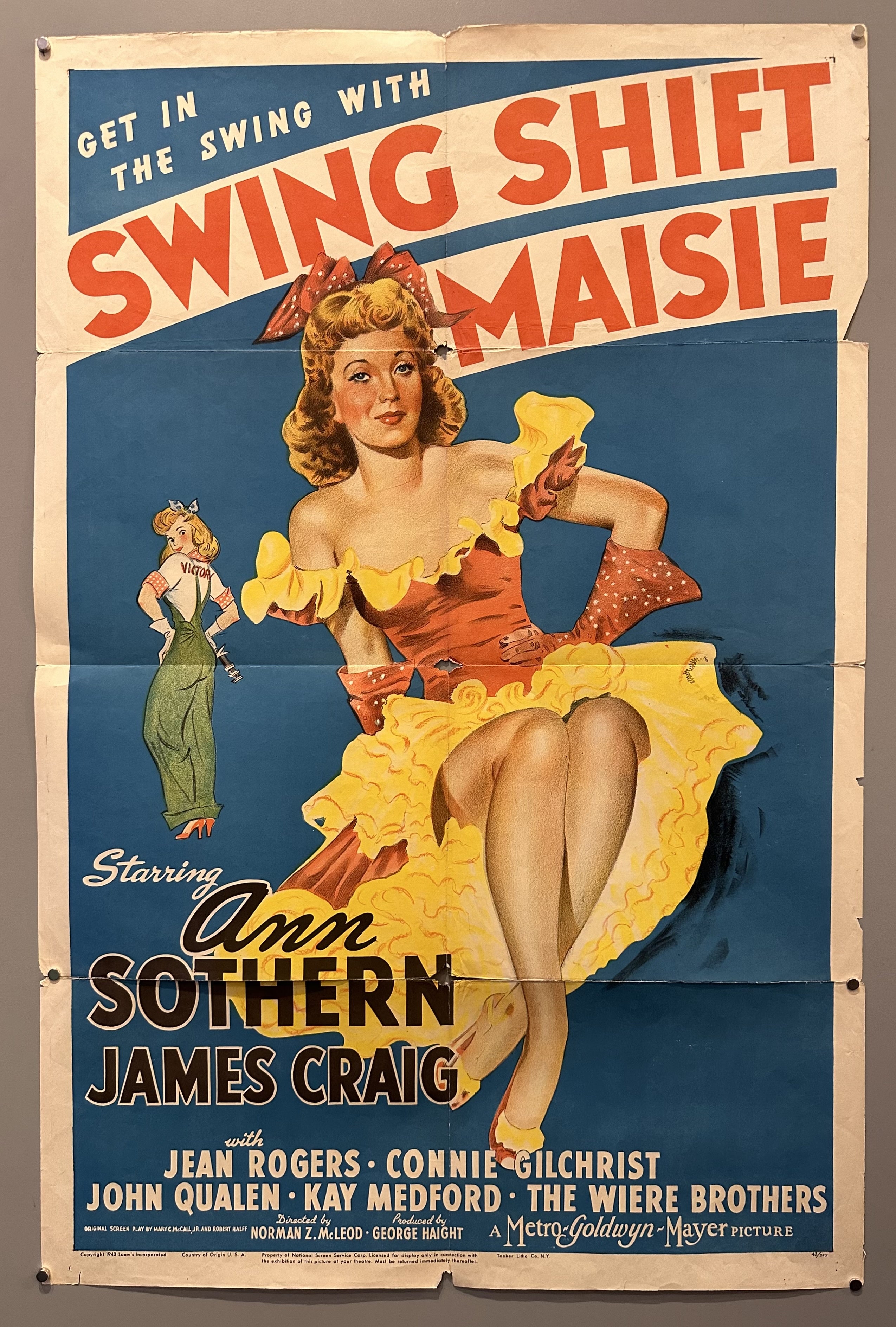 Illustration of a woman posing in a yellow dress with movie title above her and cast listed below her.