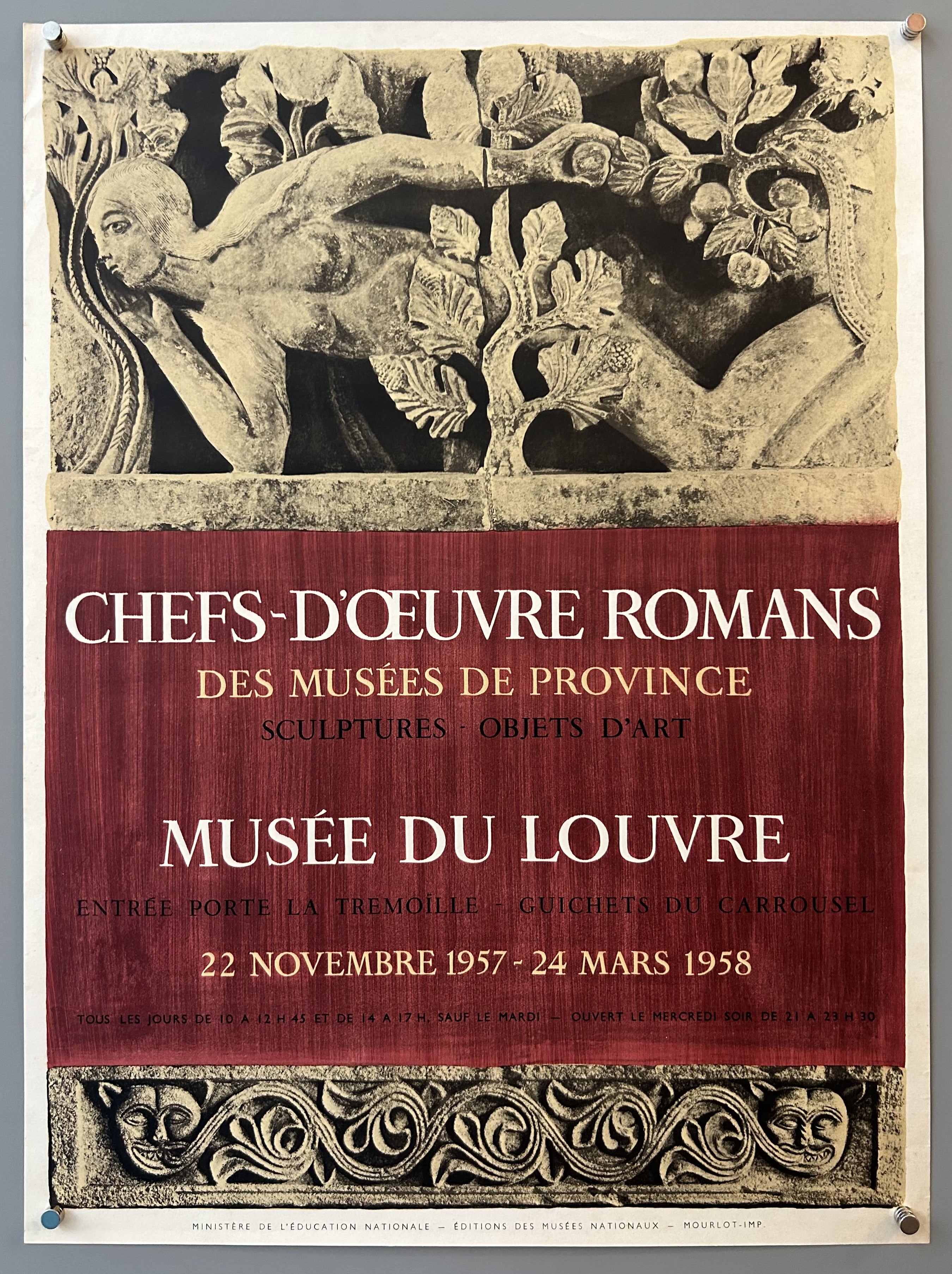 Close-up photograph of sculpture with red border underneath in art exhibition poster.