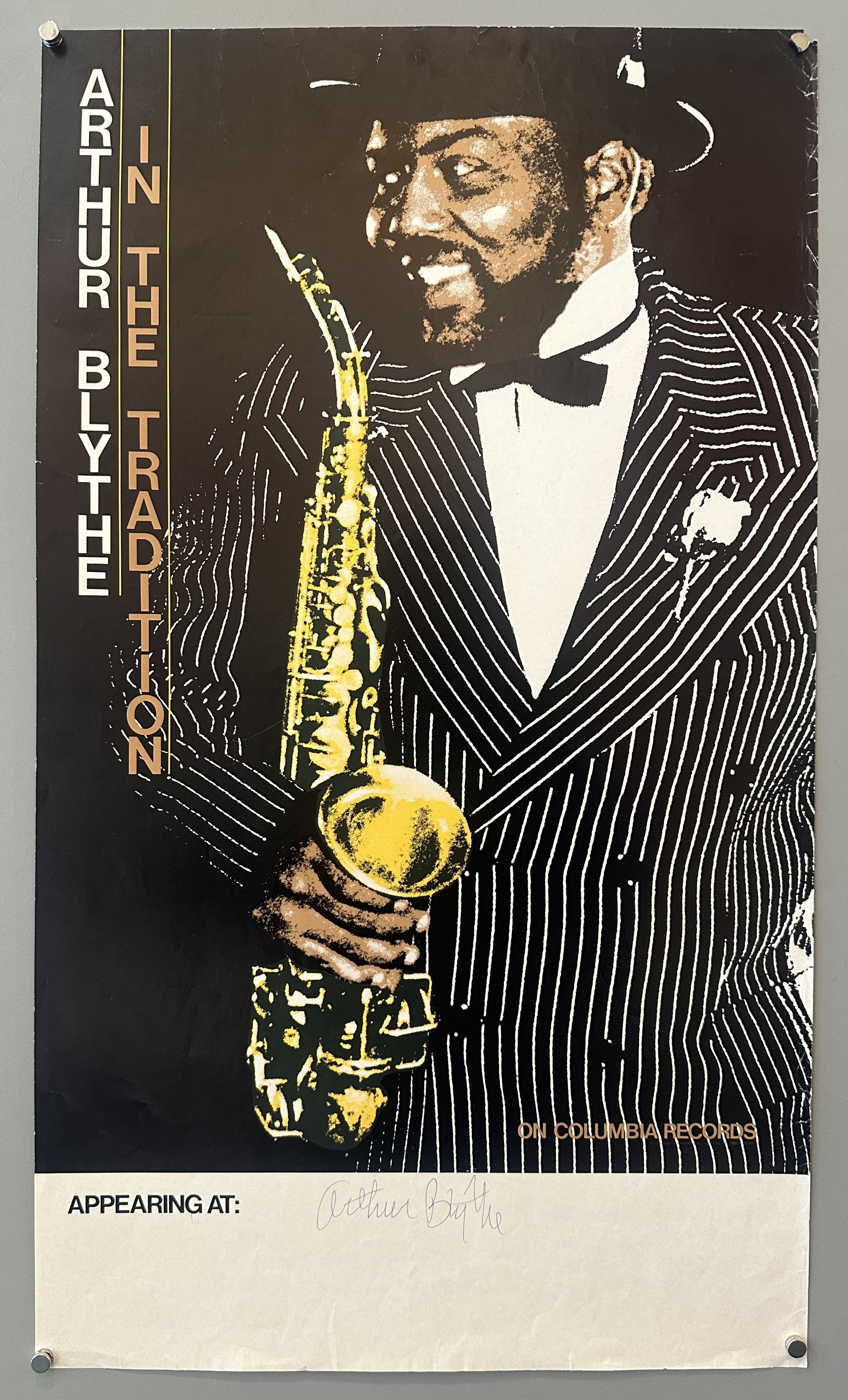 Illustration of American saxophonist Arthur Blythe against black background with white bar underneath to display signature and appearance venue.