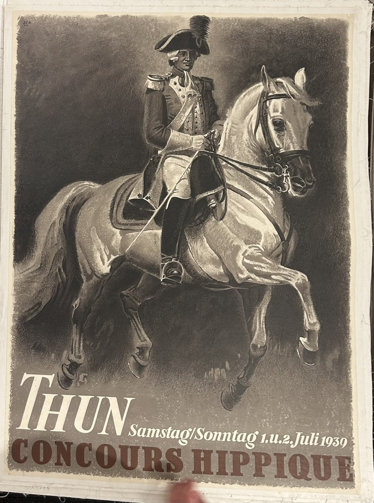 The central image depicts a figure in historical military attire on horseback, suggesting a connection to equestrian tradition and skill.
