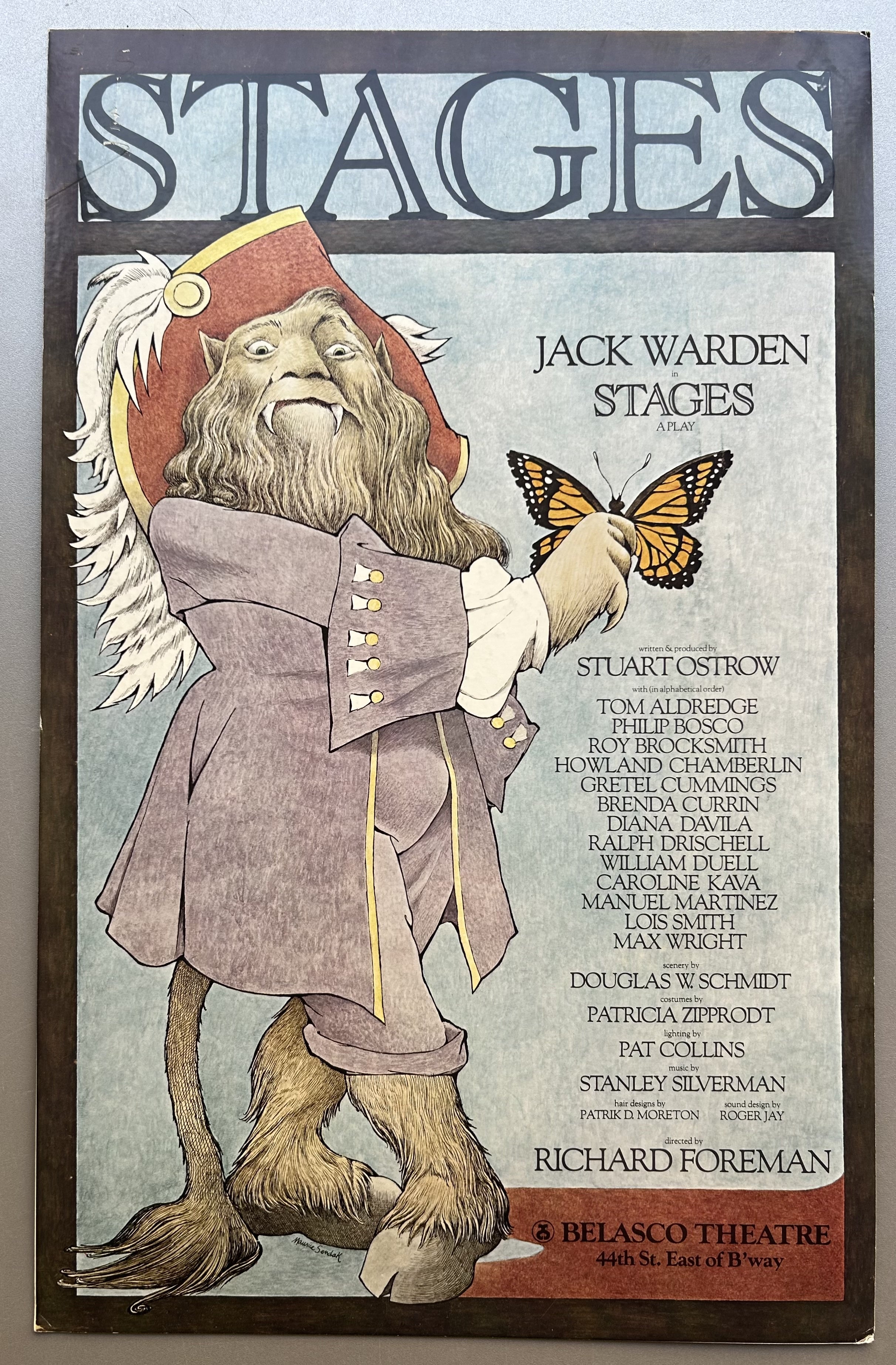 A monstrous creature holds a monarch butterfly on his finger in theatre poster.