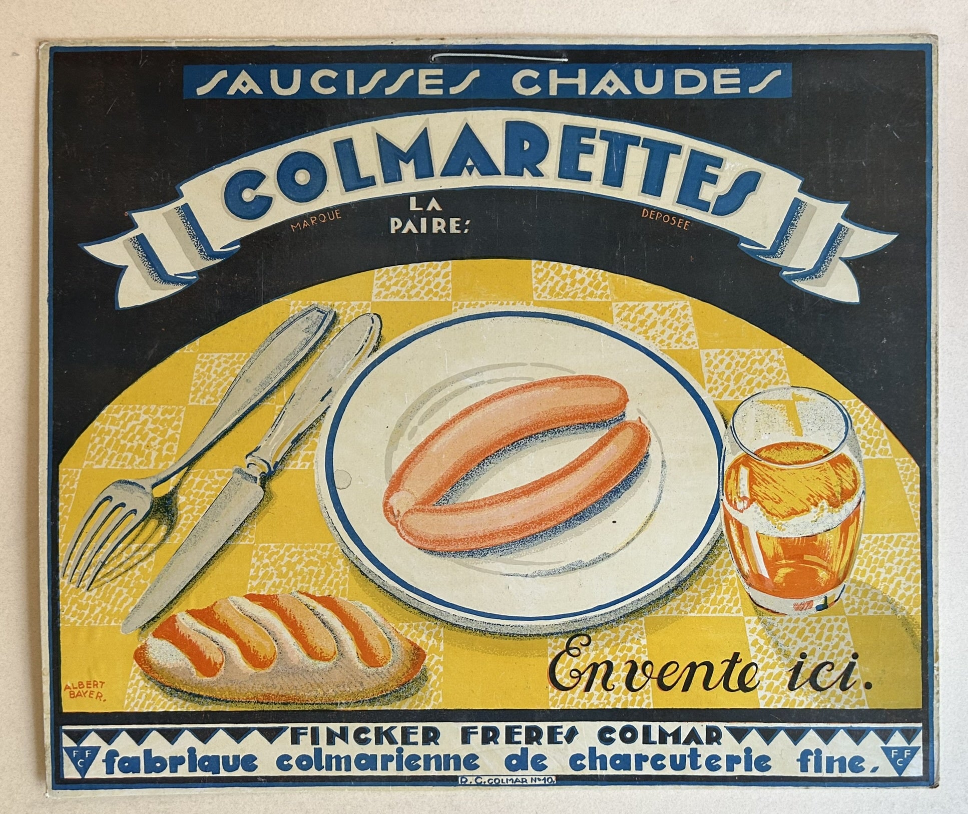 Vintage French advertisement for "Colmarettes" hot sausages, featuring two sausages on a plate, a fork and knife, a glass of amber liquid, and a loaf of bread, all set against a yellow and black checkered background