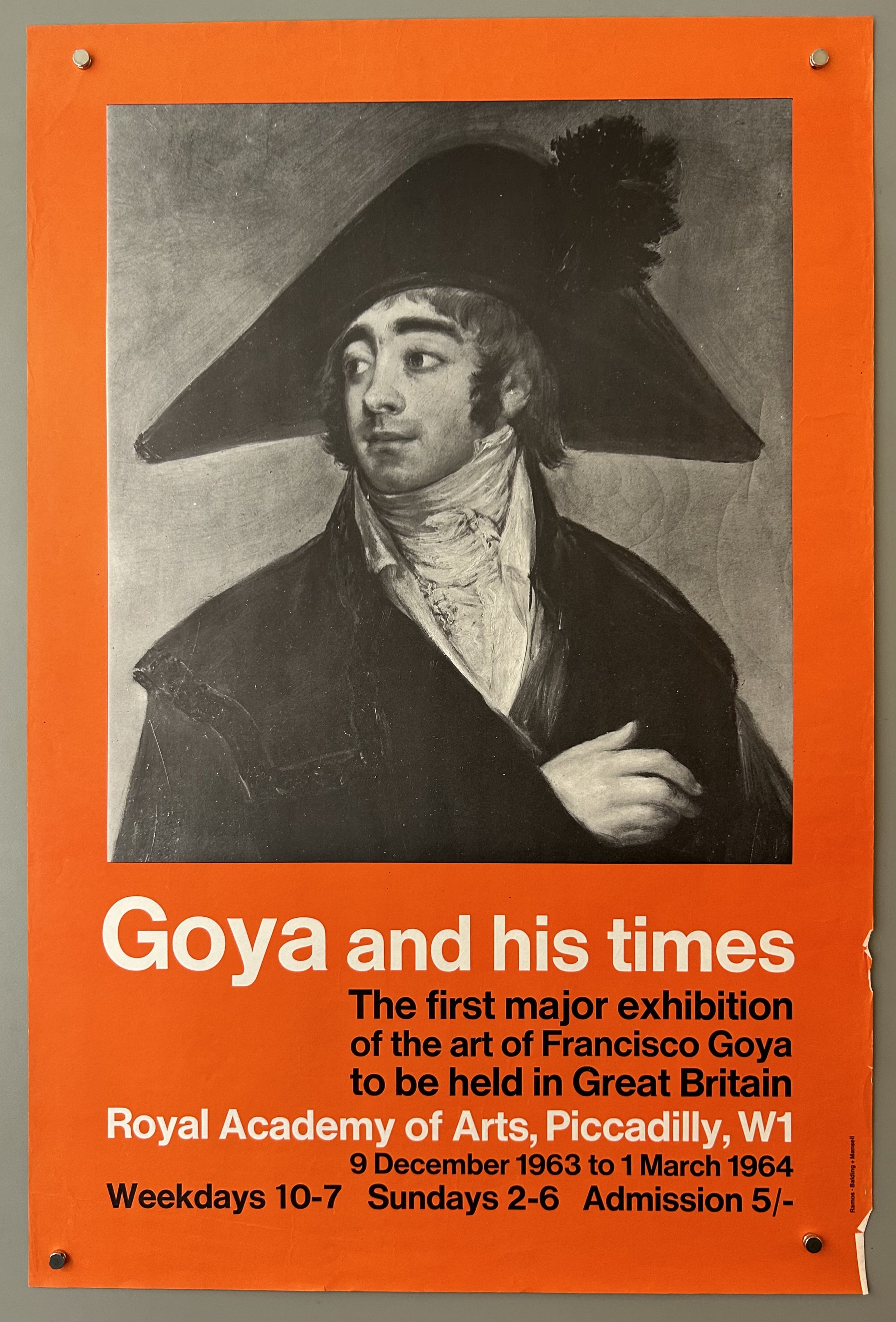 Orange poster with black and white painting from Goya in center; white and black text below.