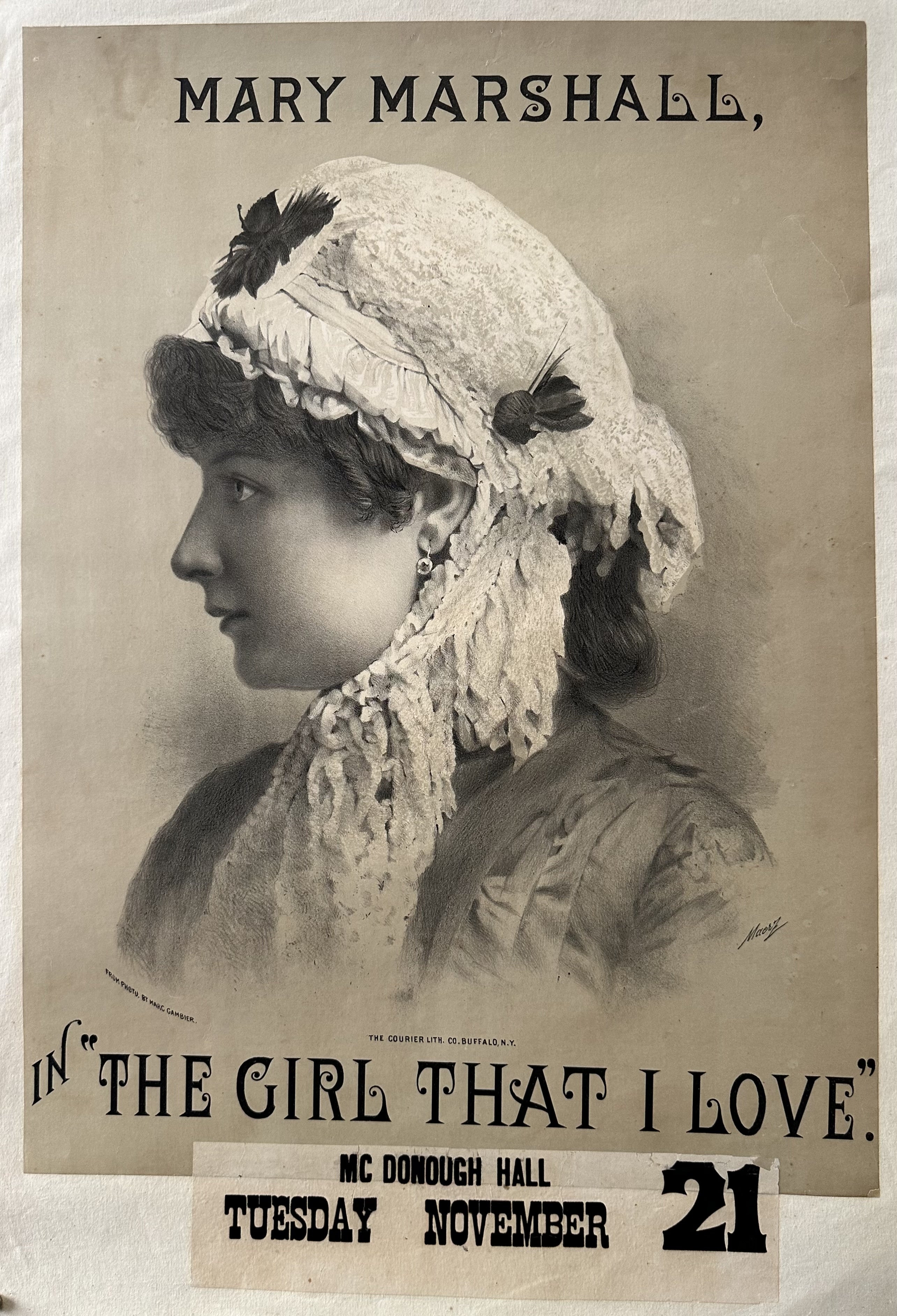 Advertisement for the play "The Girl That I love", featured is a portrait of Mary Marshall.