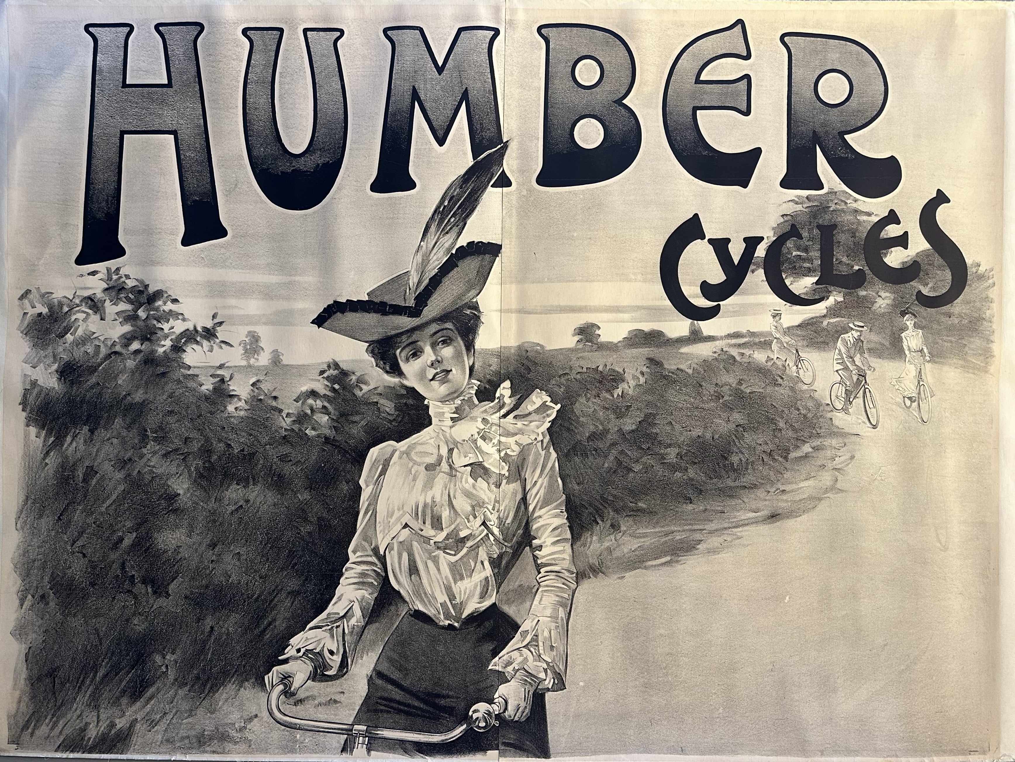 Black and white horizontally-oriented poster for Humber Cycles, featuring a woman smiling at the viewer on a bike with three other cyclists behind her.