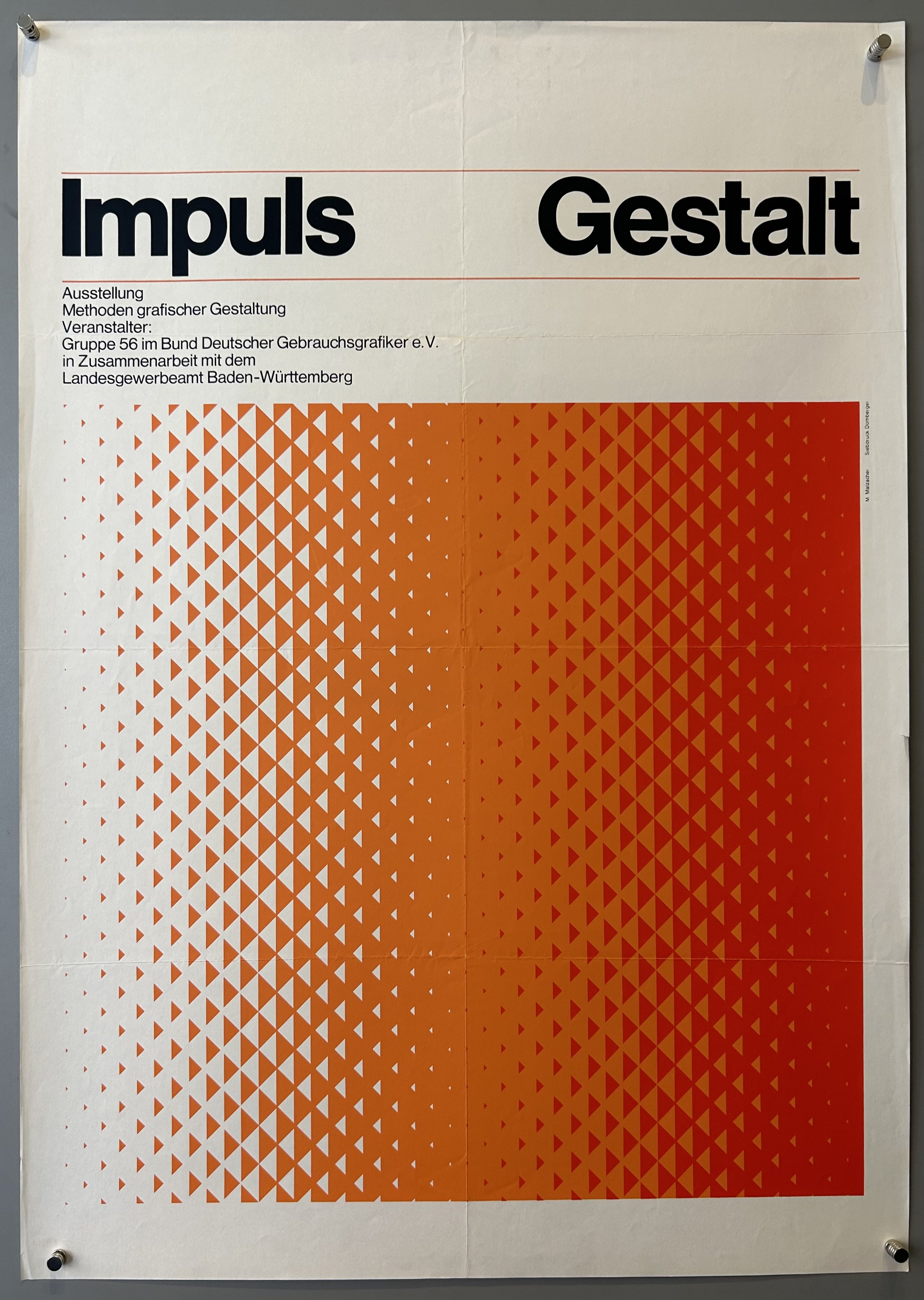 Geometric design of orange and red triangles in bottom center, black text along top.