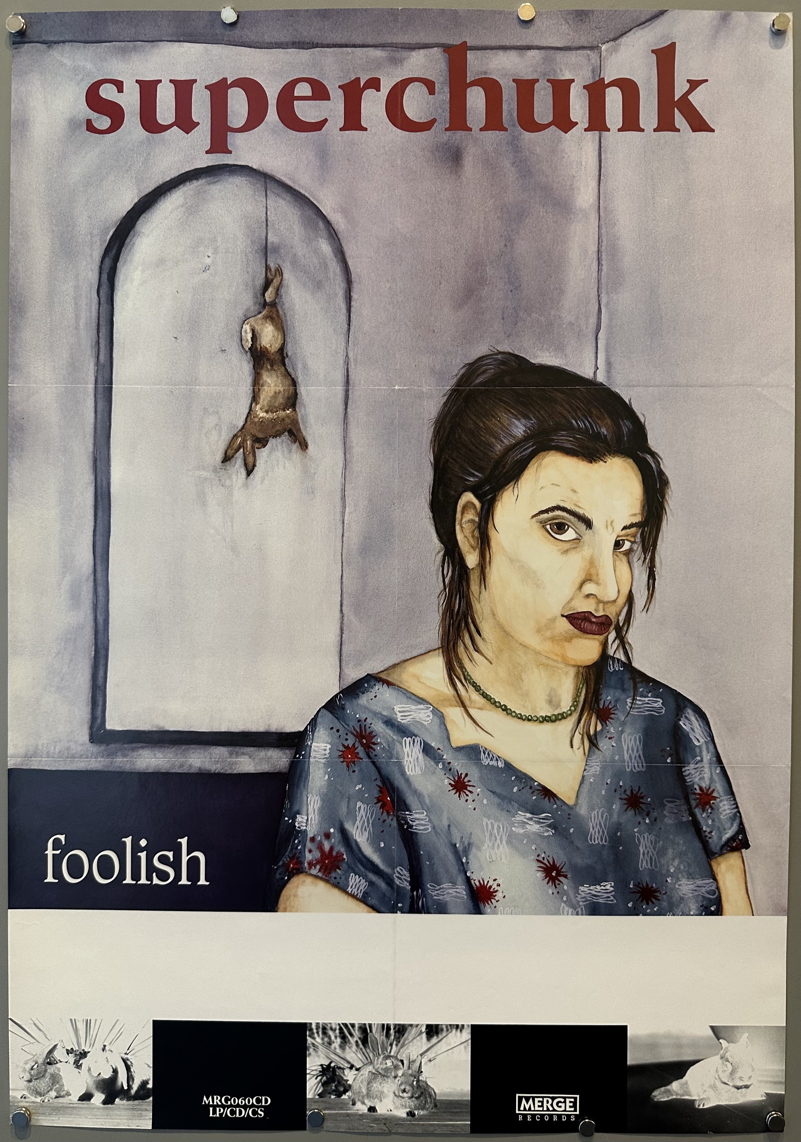 An illustrated woman looks directly at viewer while dead rabbit hangs from a doorway arch to promote indie rock album.