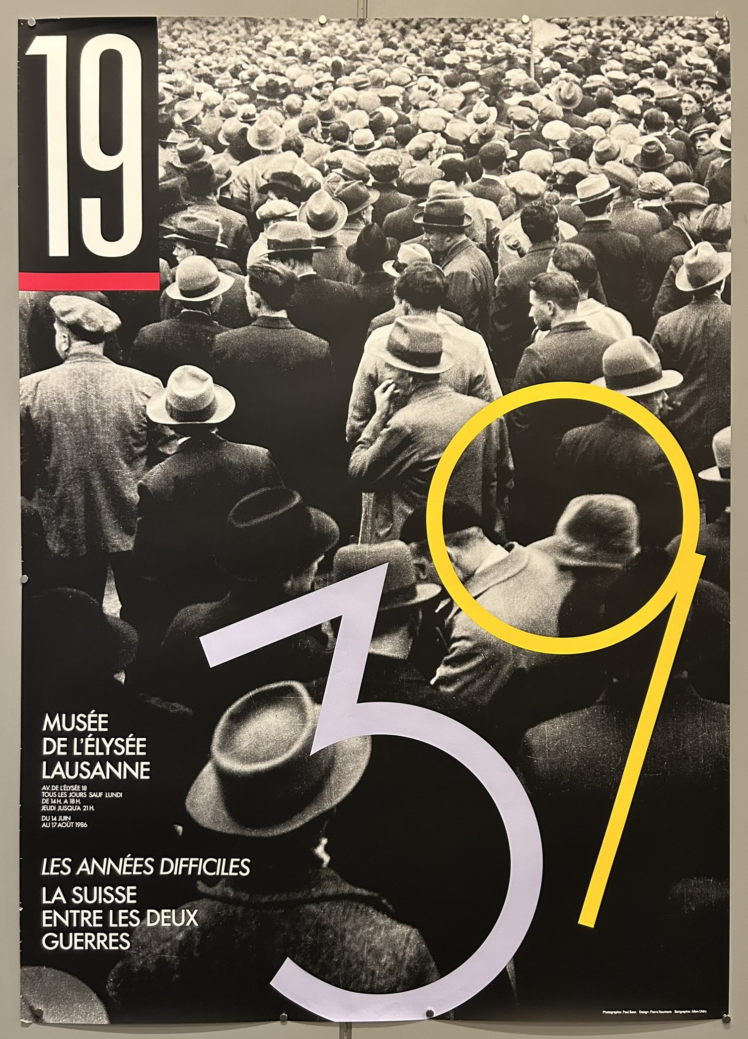 This poster promotes an exhibition titled "19-39, Les Années Difficiles; La Suisse entre les deux guerres" (The Difficult Years; Switzerland between the two wars) held at the Musée de l'Élysée in Lausanne, Switzerland.