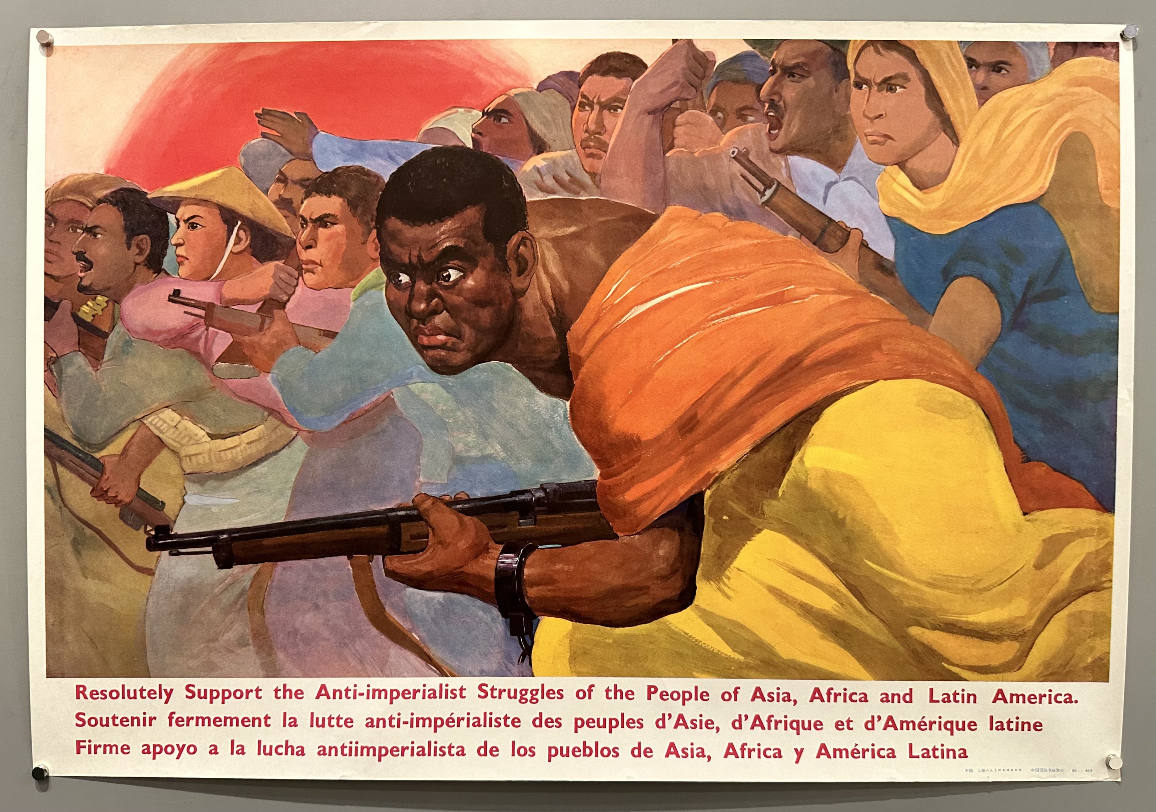 A group of people hold rifles as the caption announces their struggle against anti-imperialism.