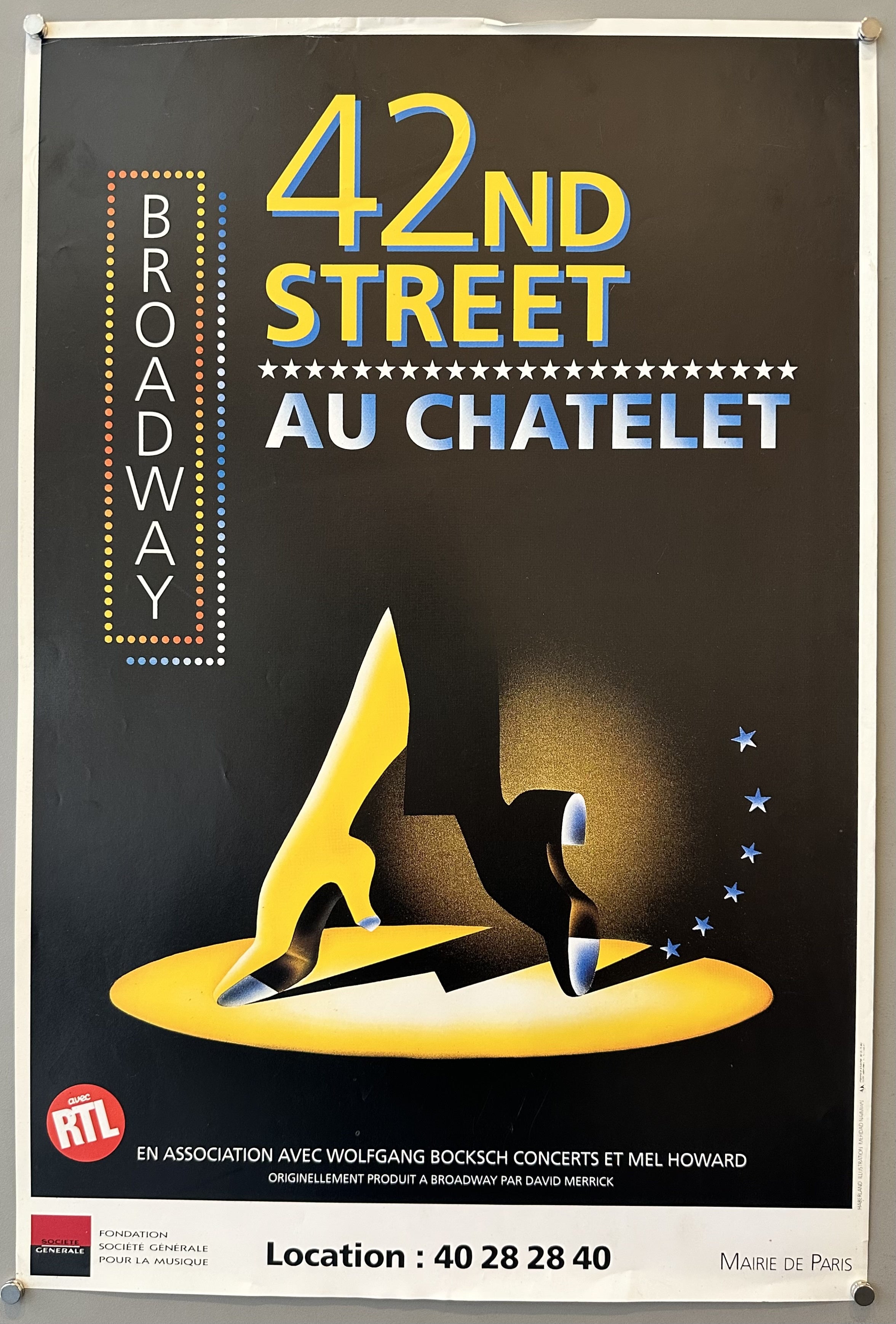 42nd Street at Chatelet Theater in Paris, with illustration of shoes dancing against black background.