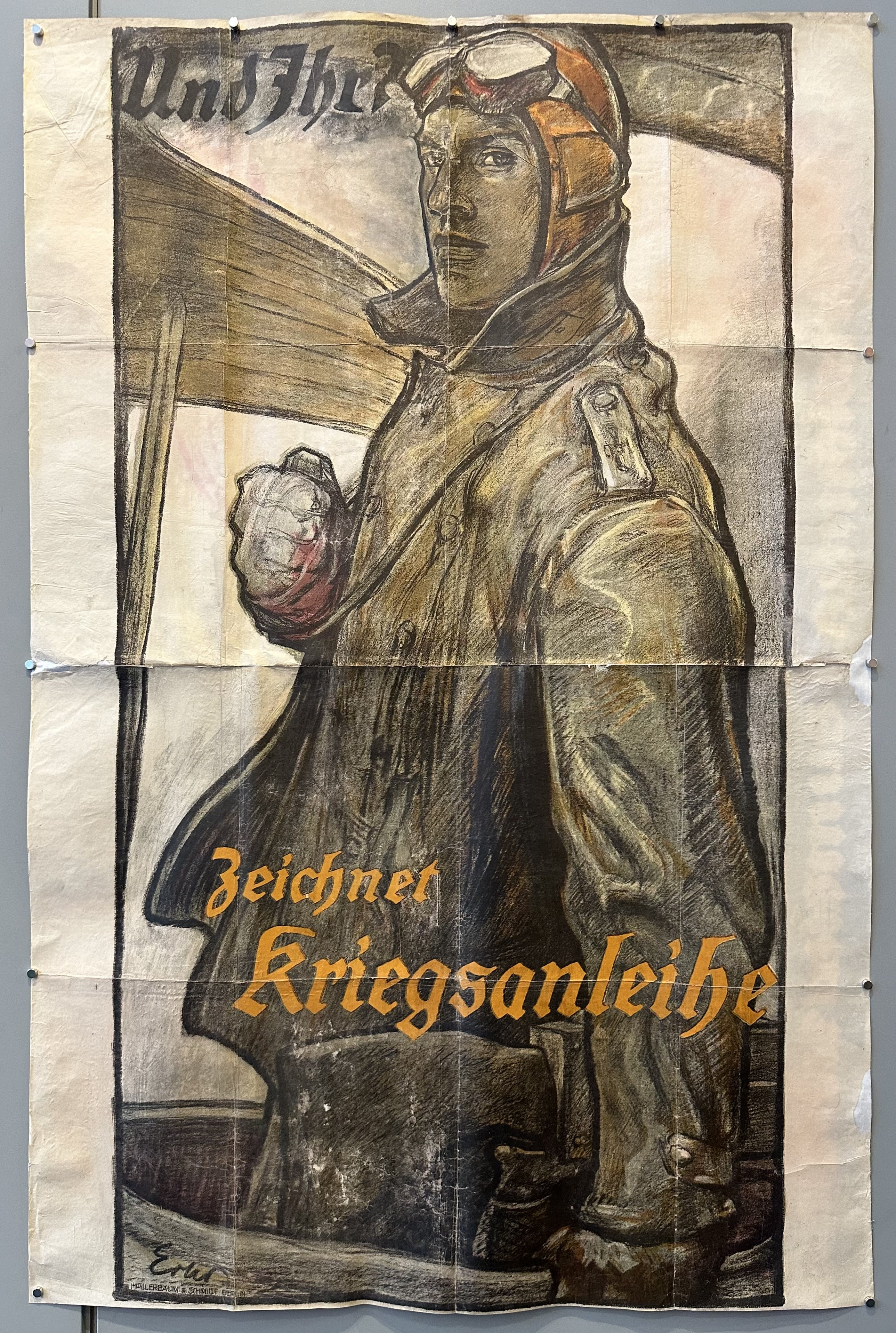 German soldier looks over his shoulder in war bond aviation poster.