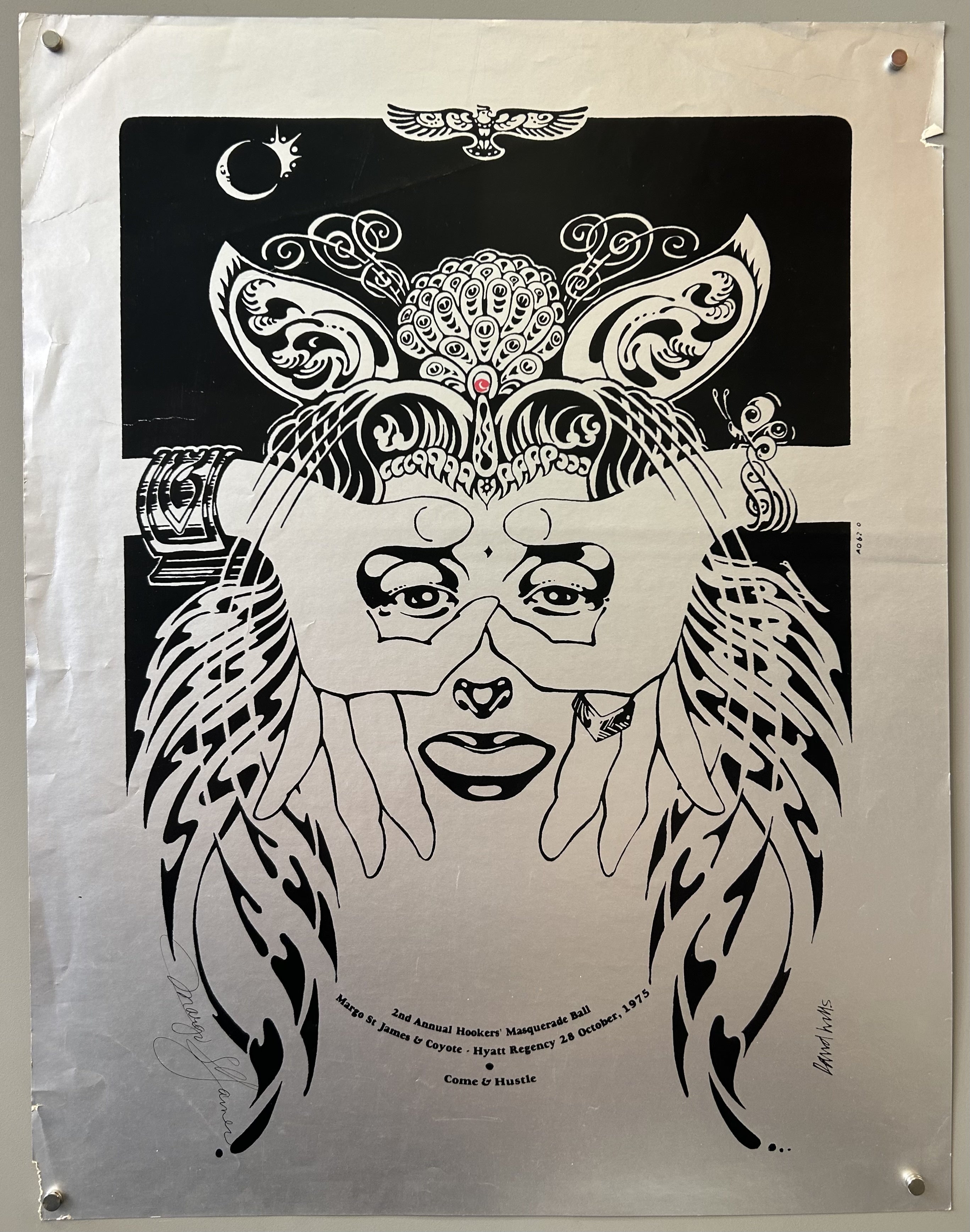 A blackand silver   poster for the "2nd Annual Hookers Masquerade Ball" on October 28, 1975, featuring a stylized illustration of a person wearing a mask and a headdress. The poster includes text that says "Margo St James & Coyote," "2nd Annual Hookers Masquerade Ball," "Hyatt Regency," "28 October, 1975," and "Come & Hustle." The artist's signature, "David Willis," is also visible.