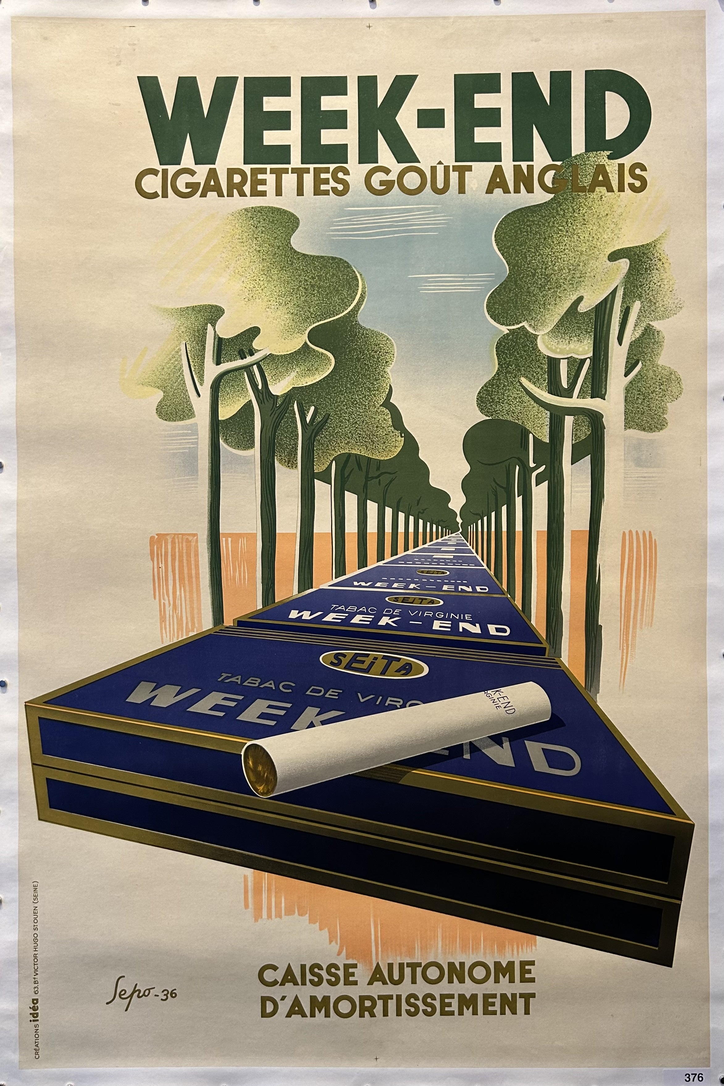 Cigarette boxes are in a row on a tree-lined street with green text above and brown text below for Week-End Cigarettes