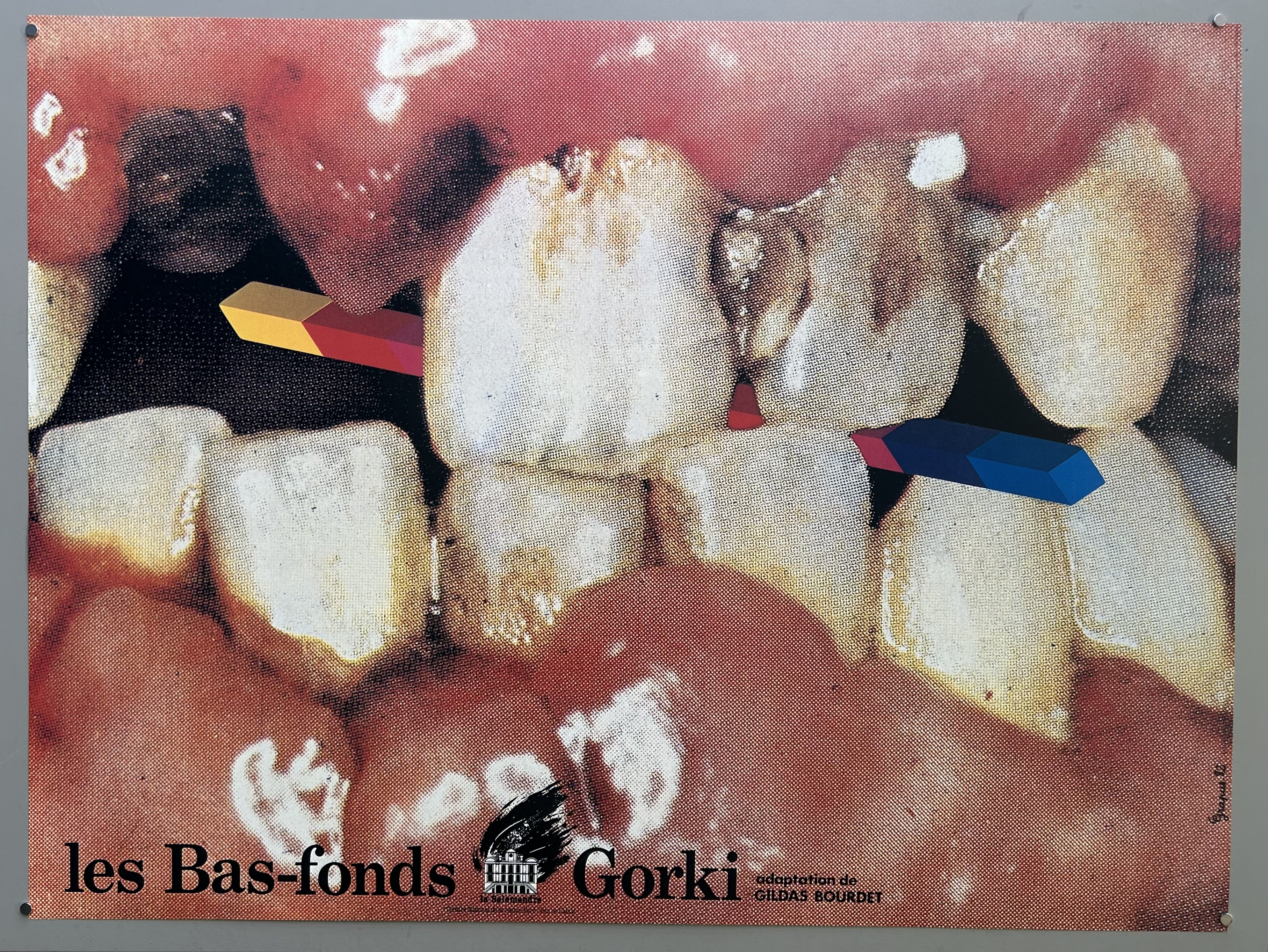 Decayed set of teeth with band of color and black typography.