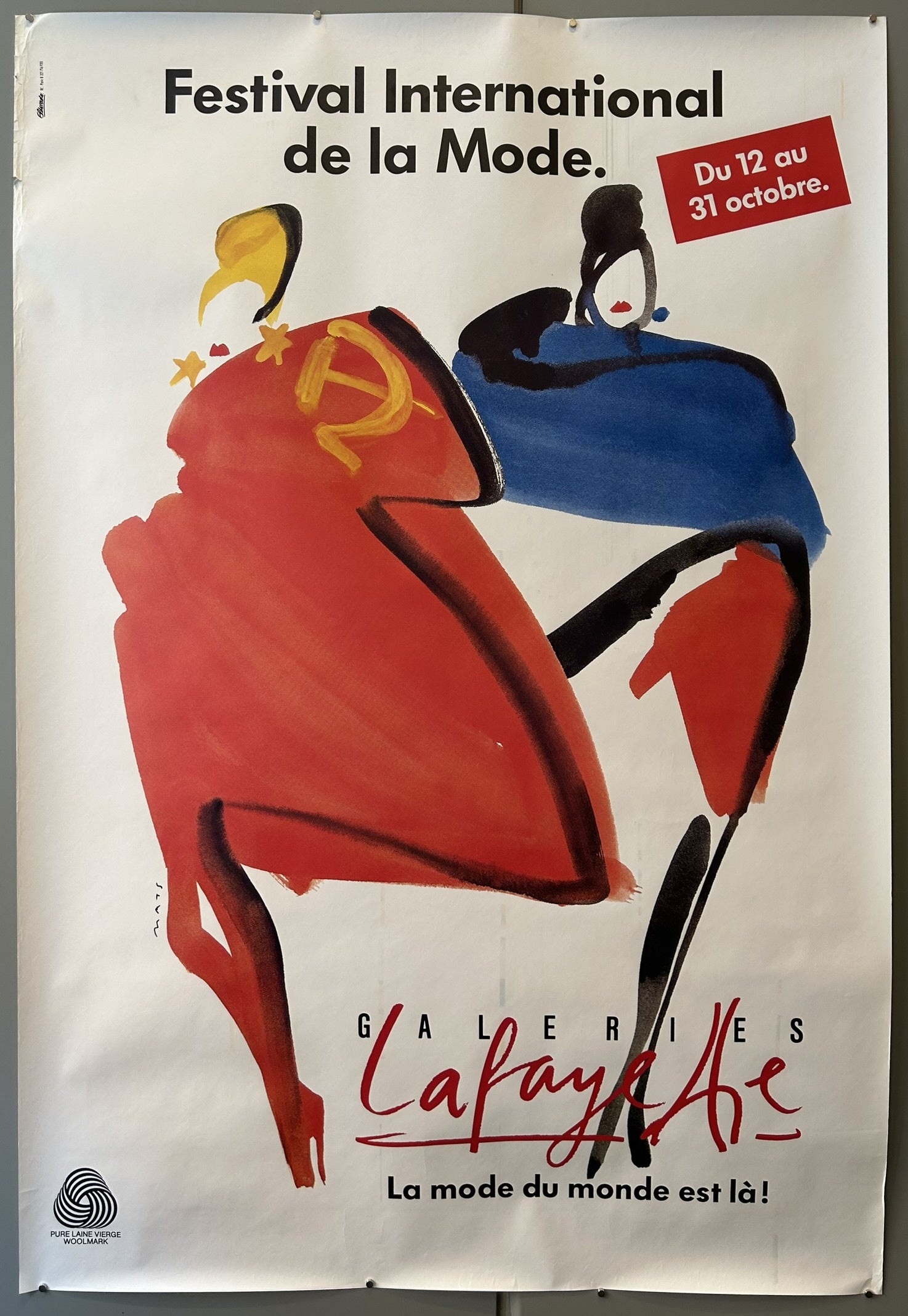 This poster advertises the Festival International de la Mode (International Fashion Festival) held at Galeries Lafayette in Paris. The festival ran from October 12th to 31st.