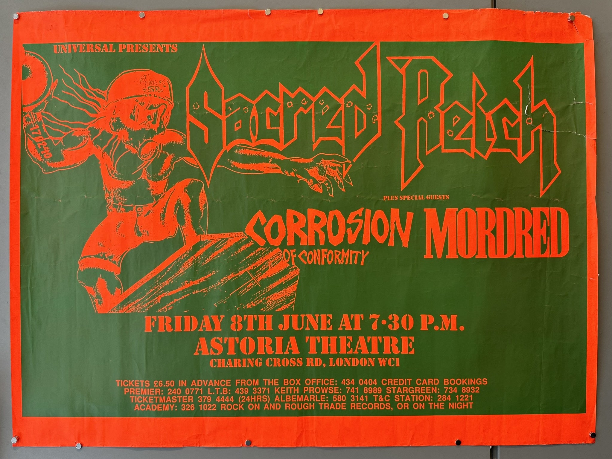 This is a concert poster for Sacred Reich, Corrosion of Conformity, and Mordred at the Astoria Theatre in London on June 8th. The poster is predominantly orange and green with an illustration of a figure on the left.