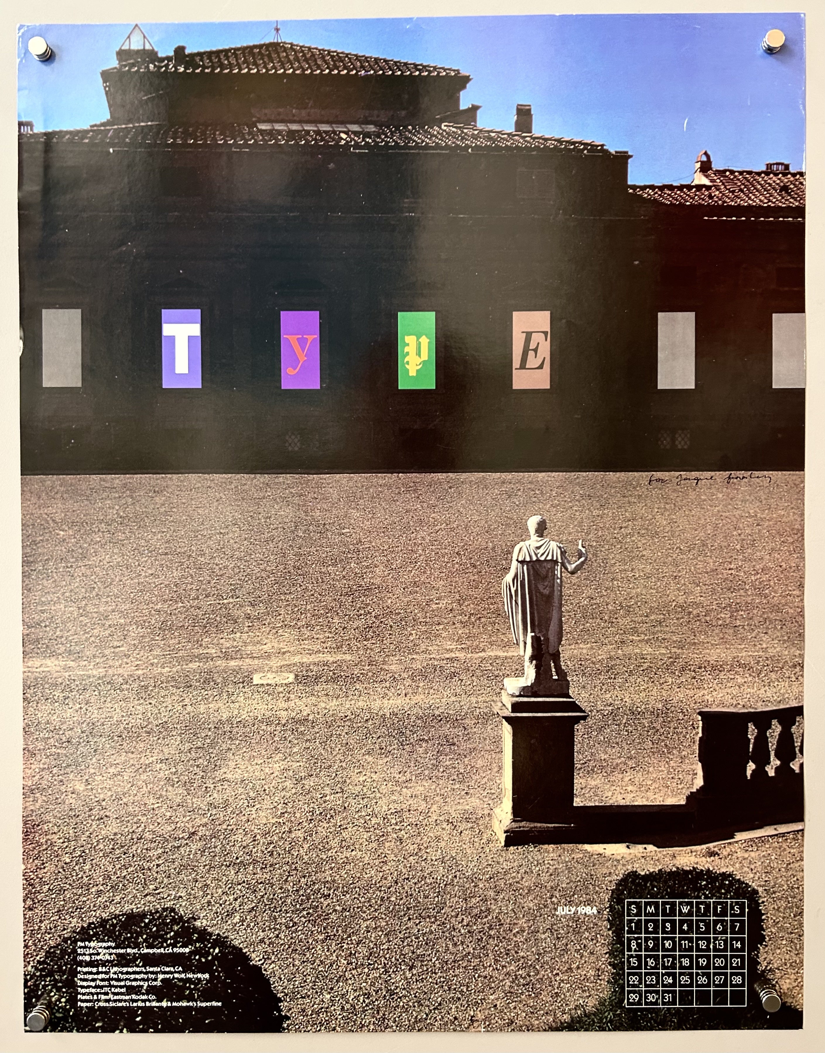 Photograph of a courtyard with a statue in it with 'TYPE' written along a building's windows to promote typography company.