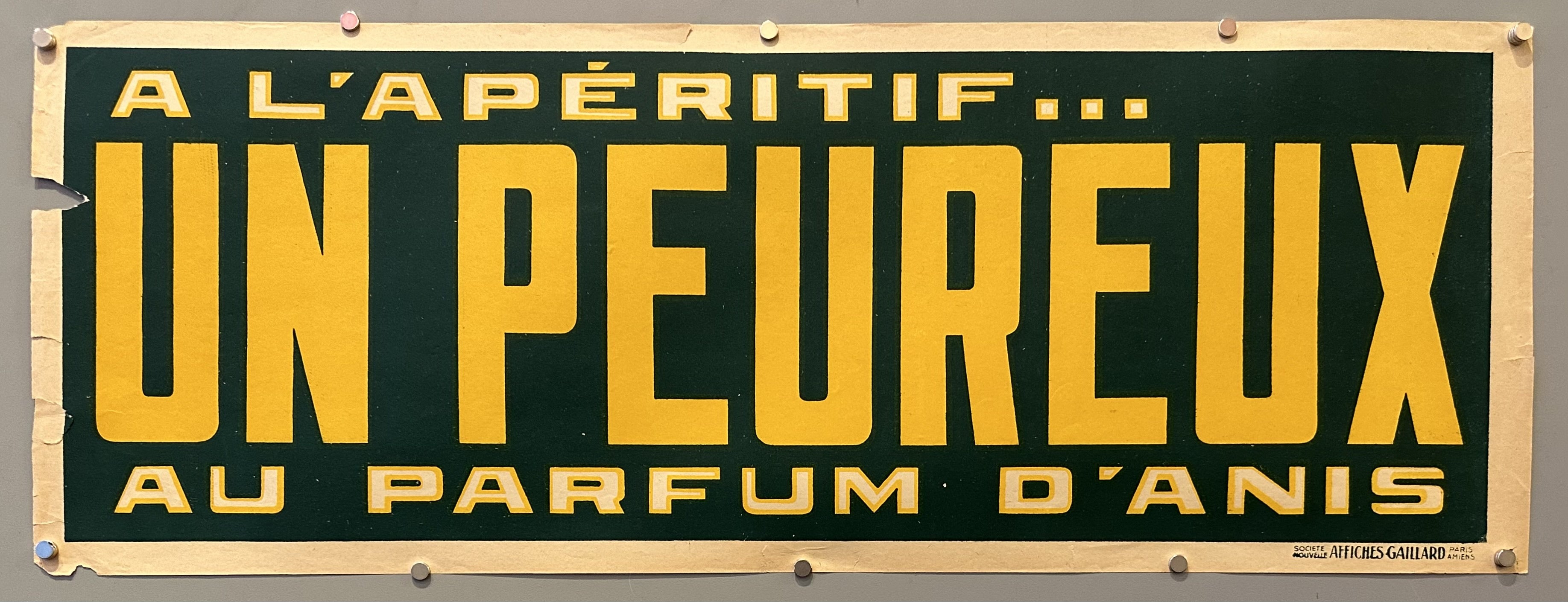 A green horizontal poster with yellow lettering.