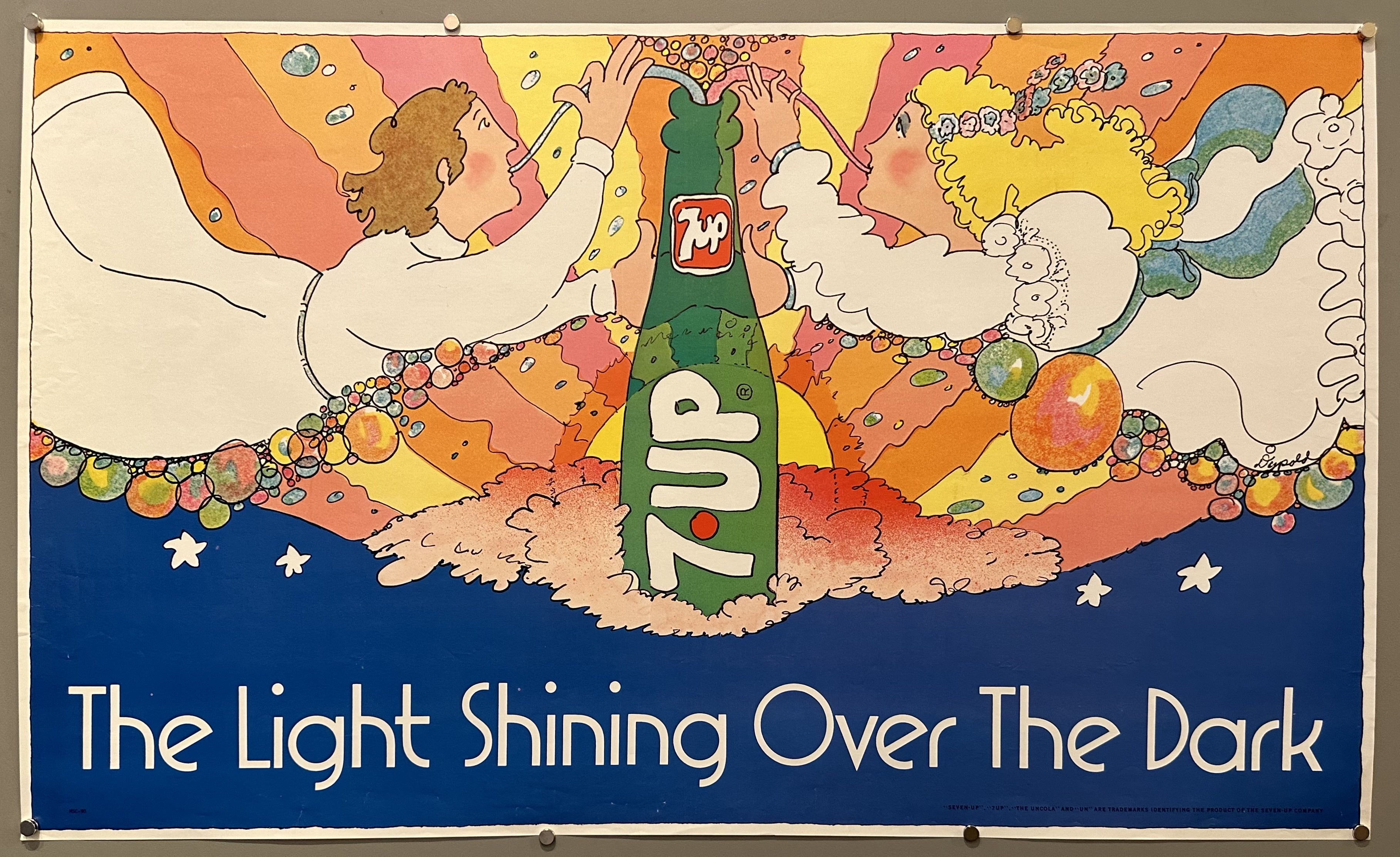 Two angels drink from a 7UP soda bottle in the sky.