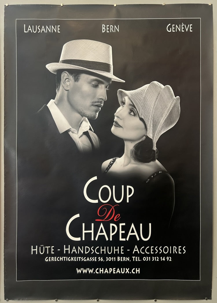 The poster for "Coup De Chapeau" is a reproduction of Roy Lichtenstein's artwork "Coup de Chapeau I" from 1996. The poster itself was produced in 2023 in conjunction with the "Lichtenstein Remembered" exhibition at Gagosian.