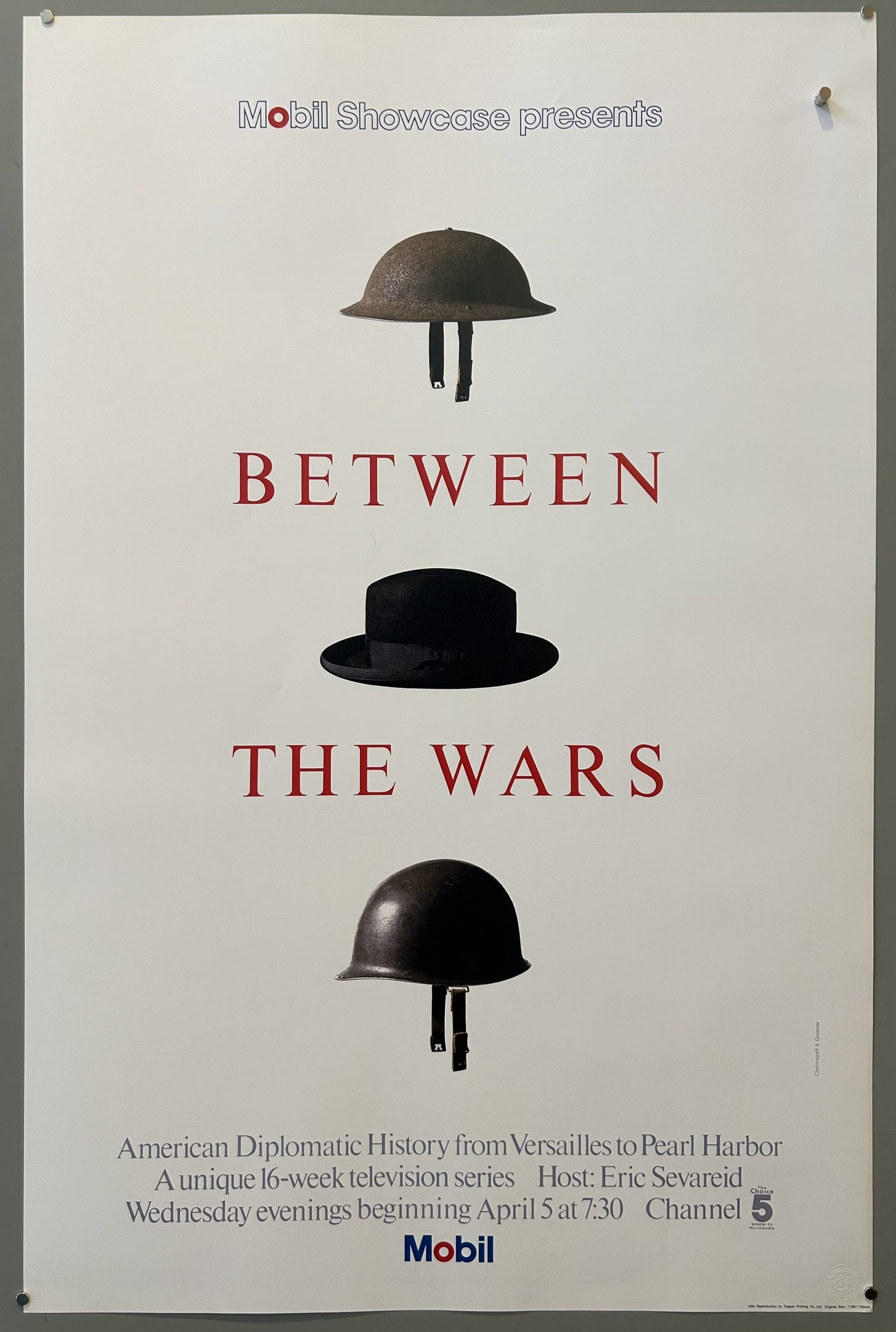 The design conceptually represents the period between World War I and World War II using headwear: a World War I helmet, a homburg hat (likely symbolizing the interwar period or figures like Churchill), and a World War II helmet,