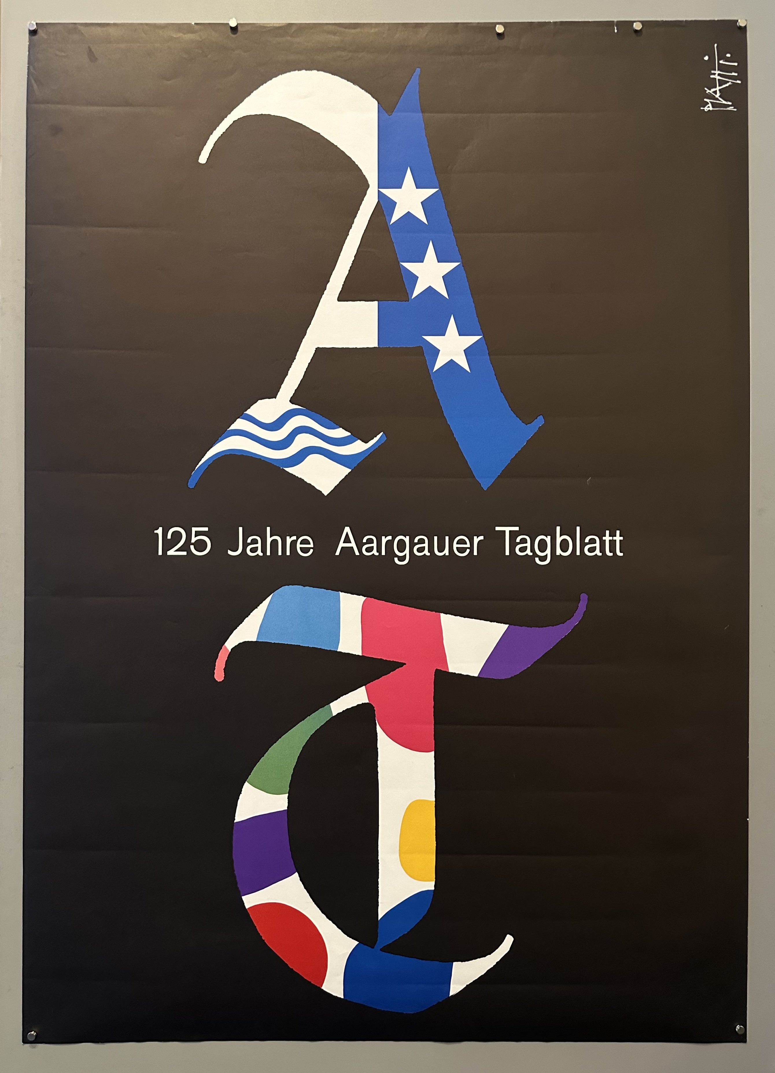 This poster was likely made to commemorate the 125th anniversary of the Aargauer Tagblatt, a Swiss newspaper. It's a celebratory piece highlighting the newspaper's long history.