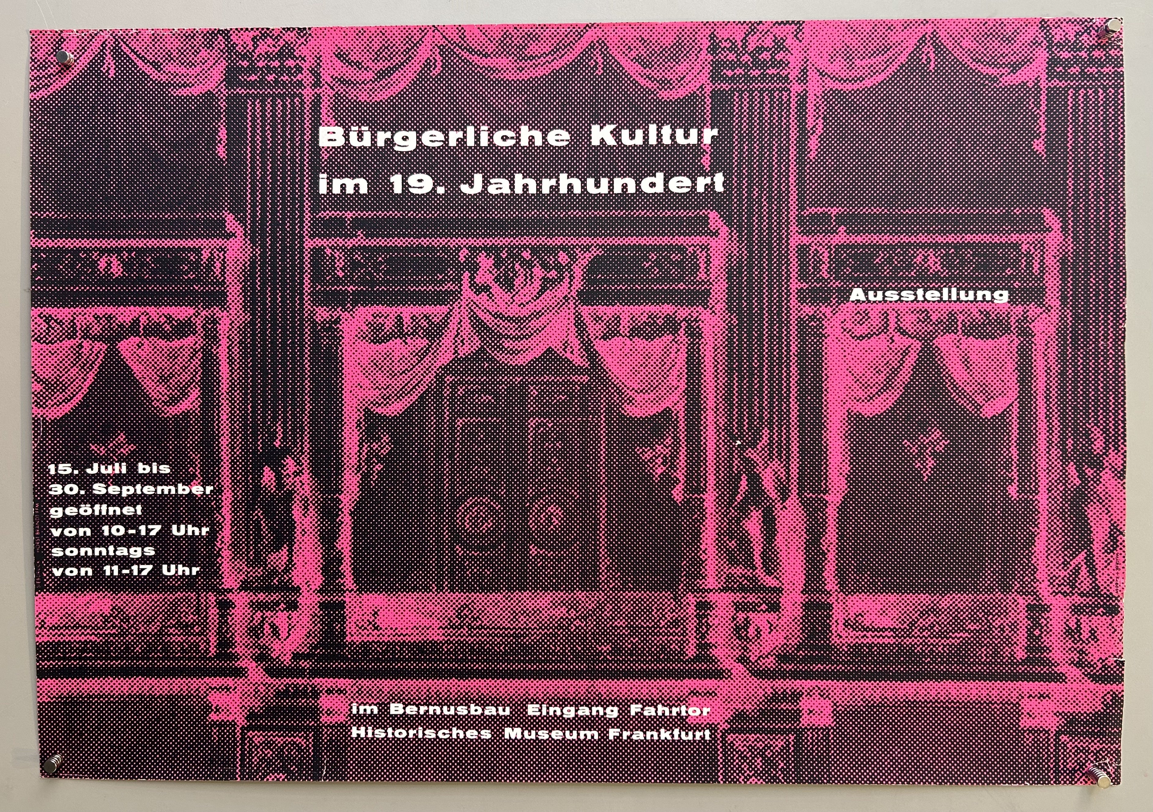 Pink stipling poster with white text and theater box as the background.