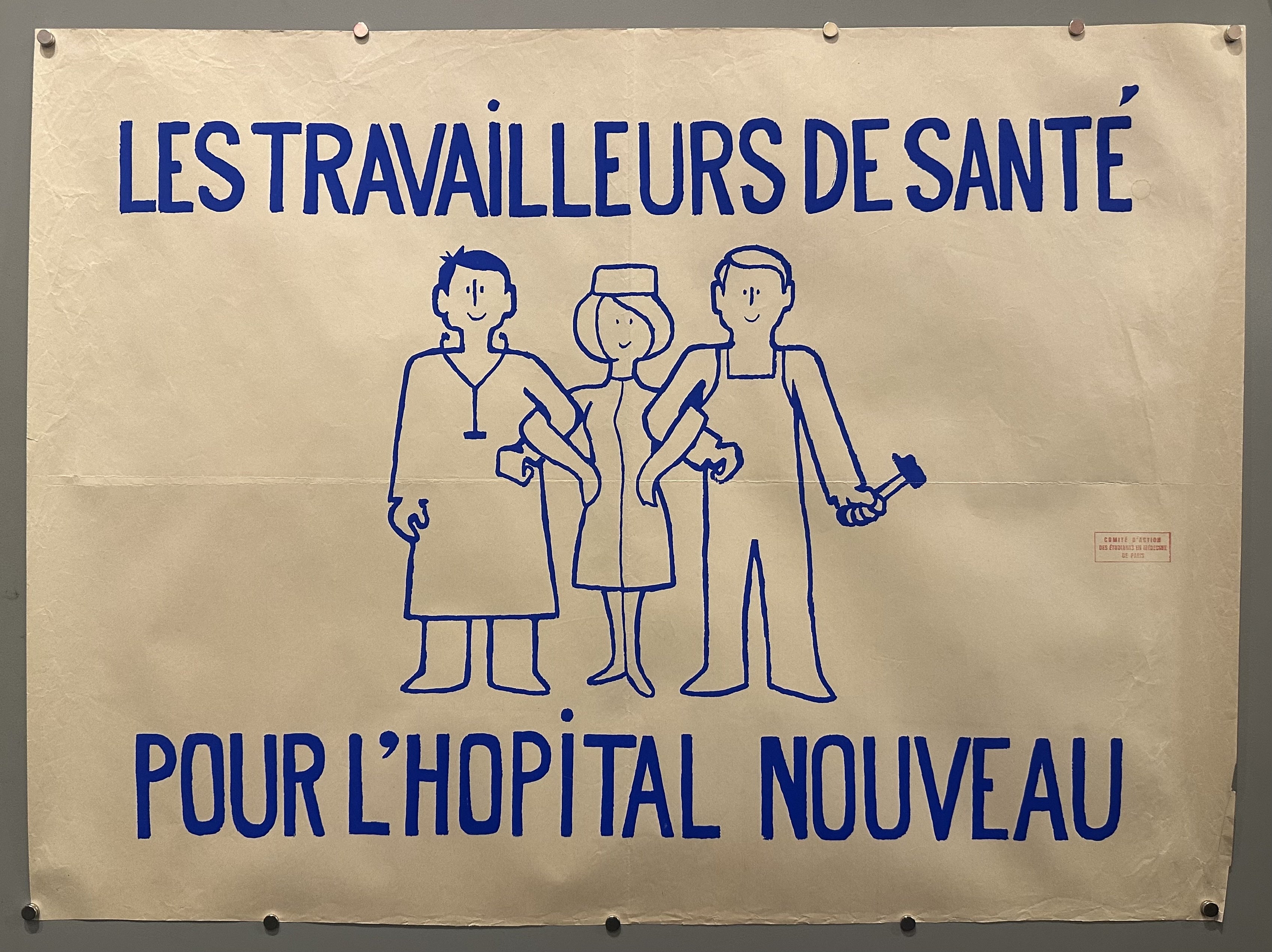 Three health workers link arms with blue text above and below them in this May 68 propaganda poster.