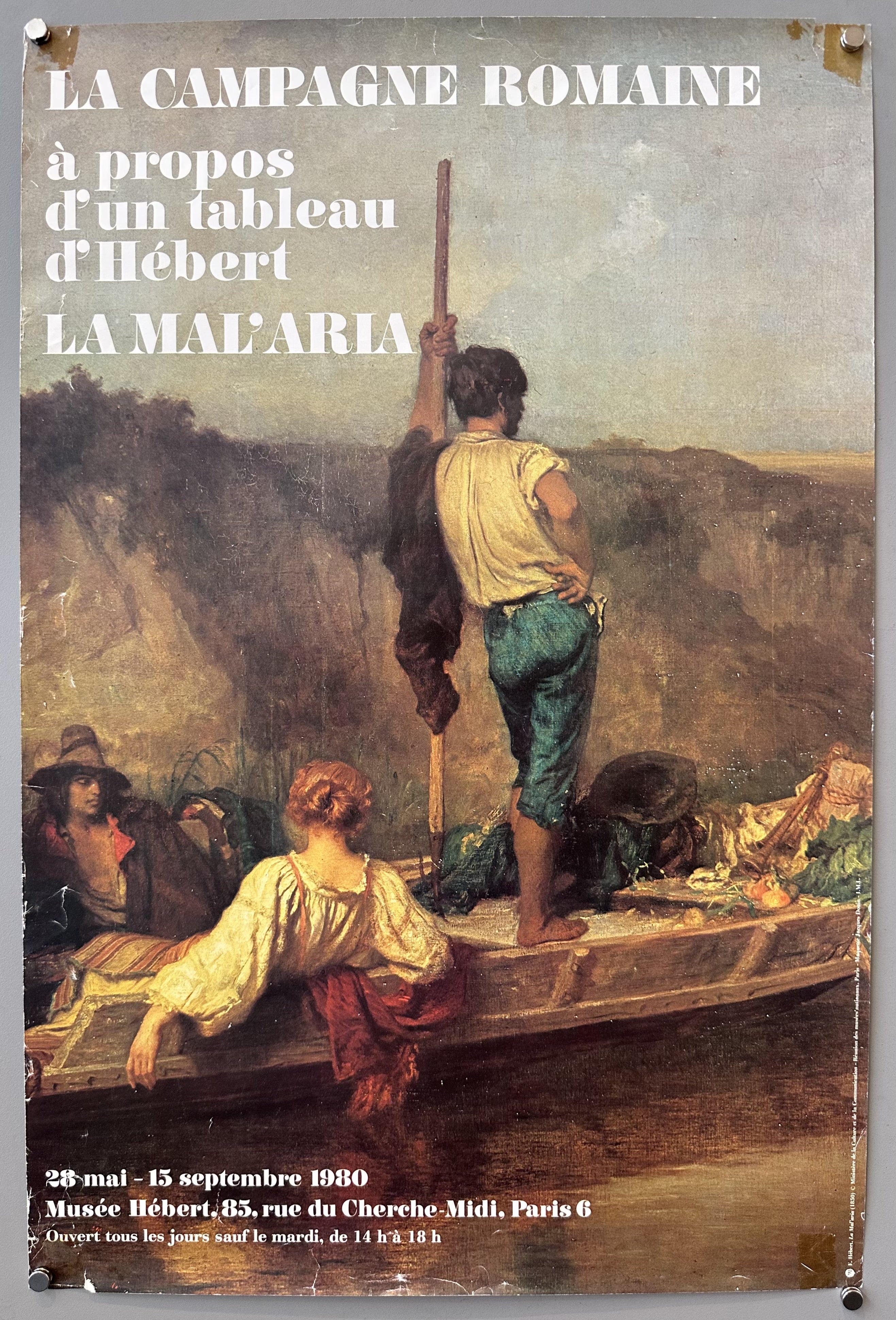 Close-up of a painting with white text promoting an exhibition at a French museum.