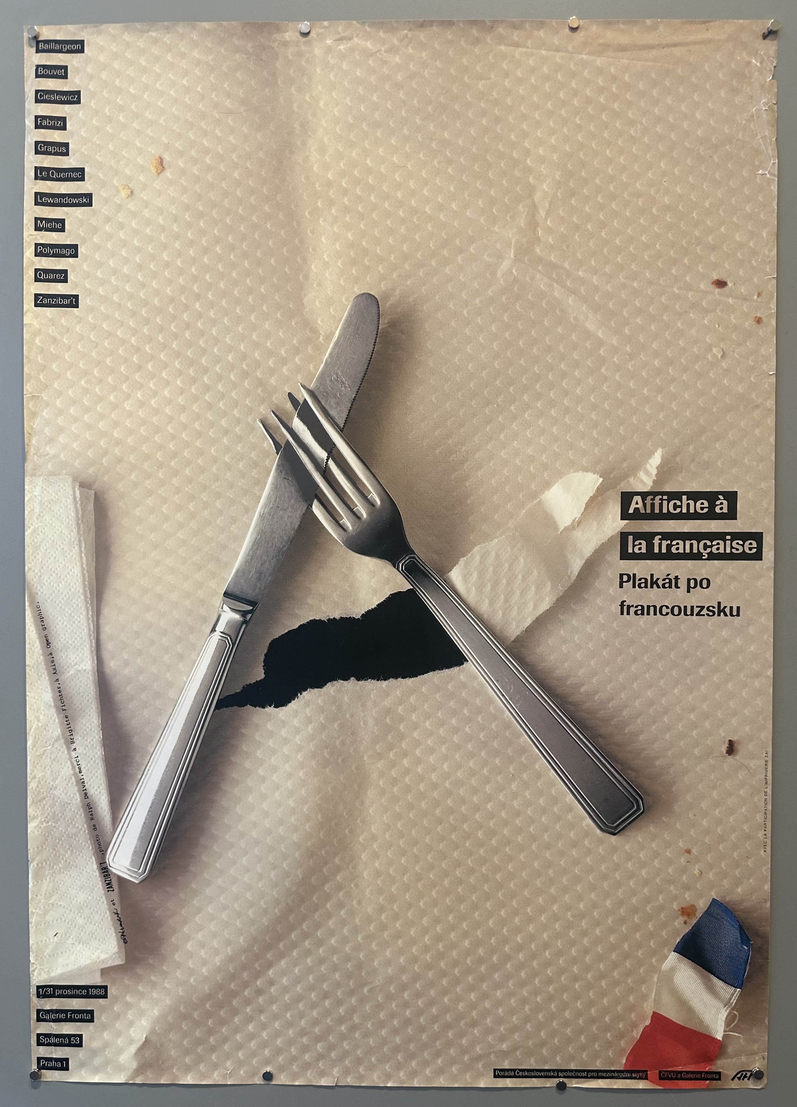 A fork and knife bend to fit into each other in this photograph promoting an art exhibition in Prague.