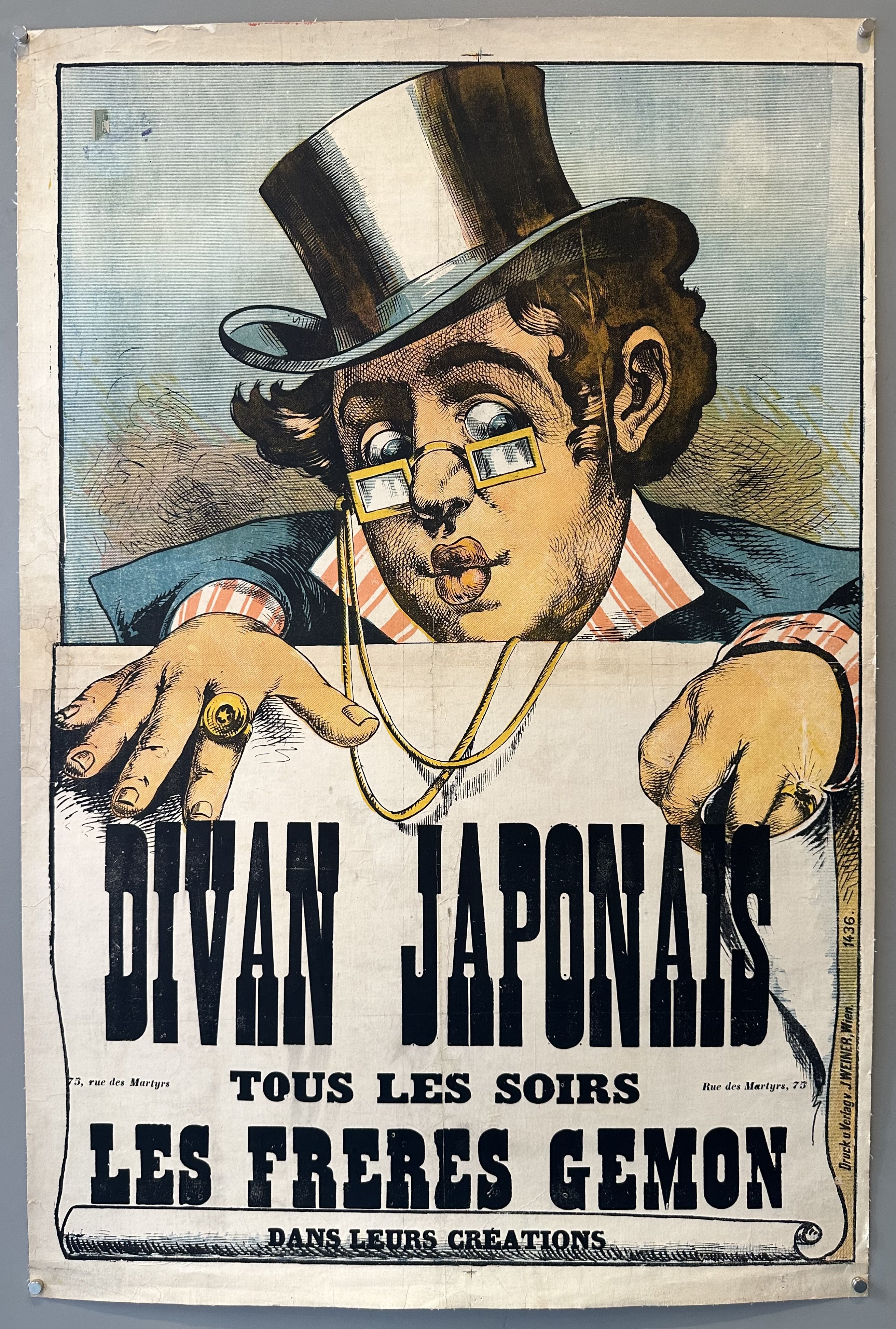 A vintage poster for the Divan Japonais cabaret in late 19th-century Montmartre, featuring a stylized man in a top hat and monocle, holding a rolled-up poster.