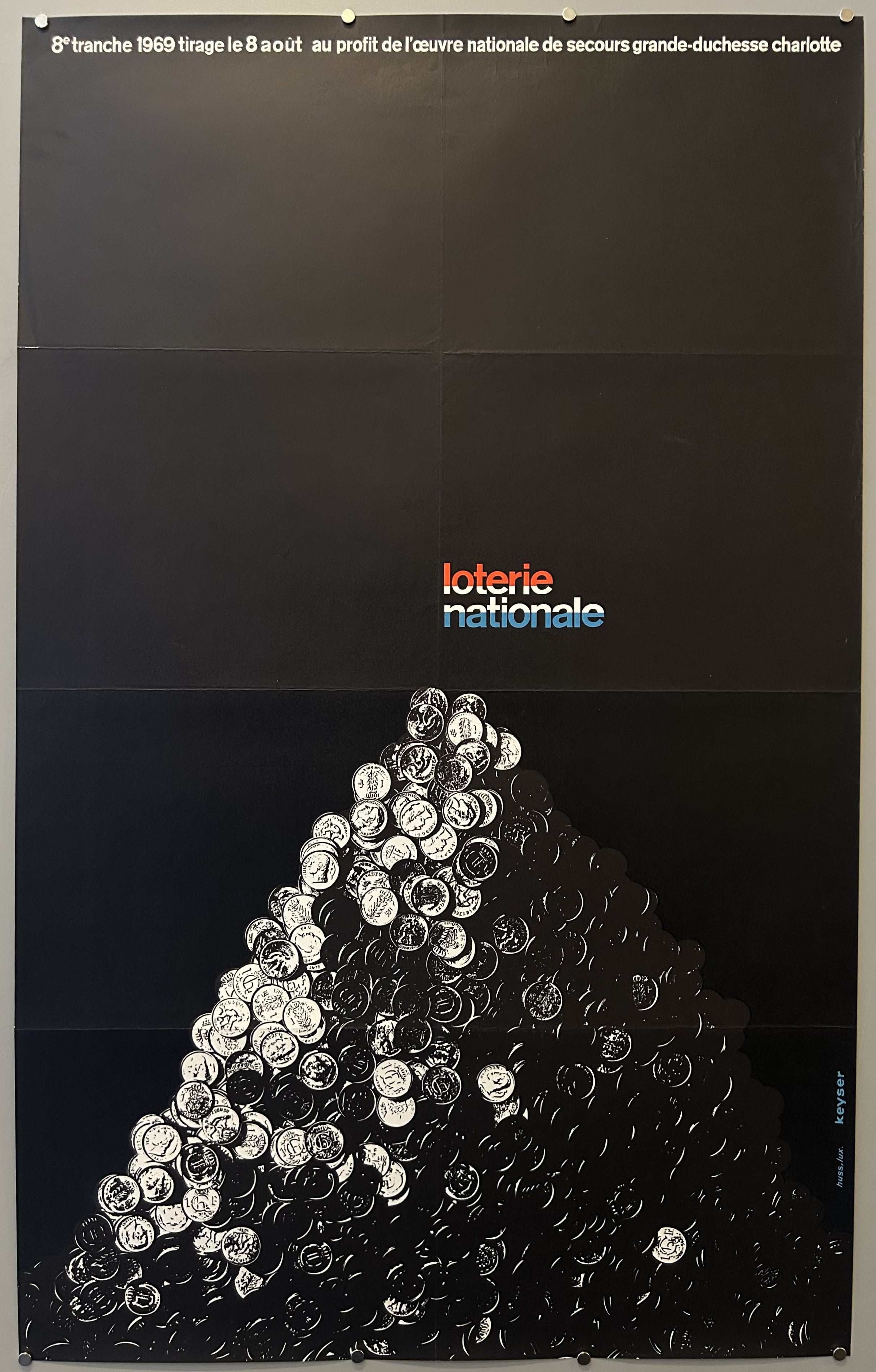 Black Loterie Nationale poster with high-contrast image of coins in a pile.
