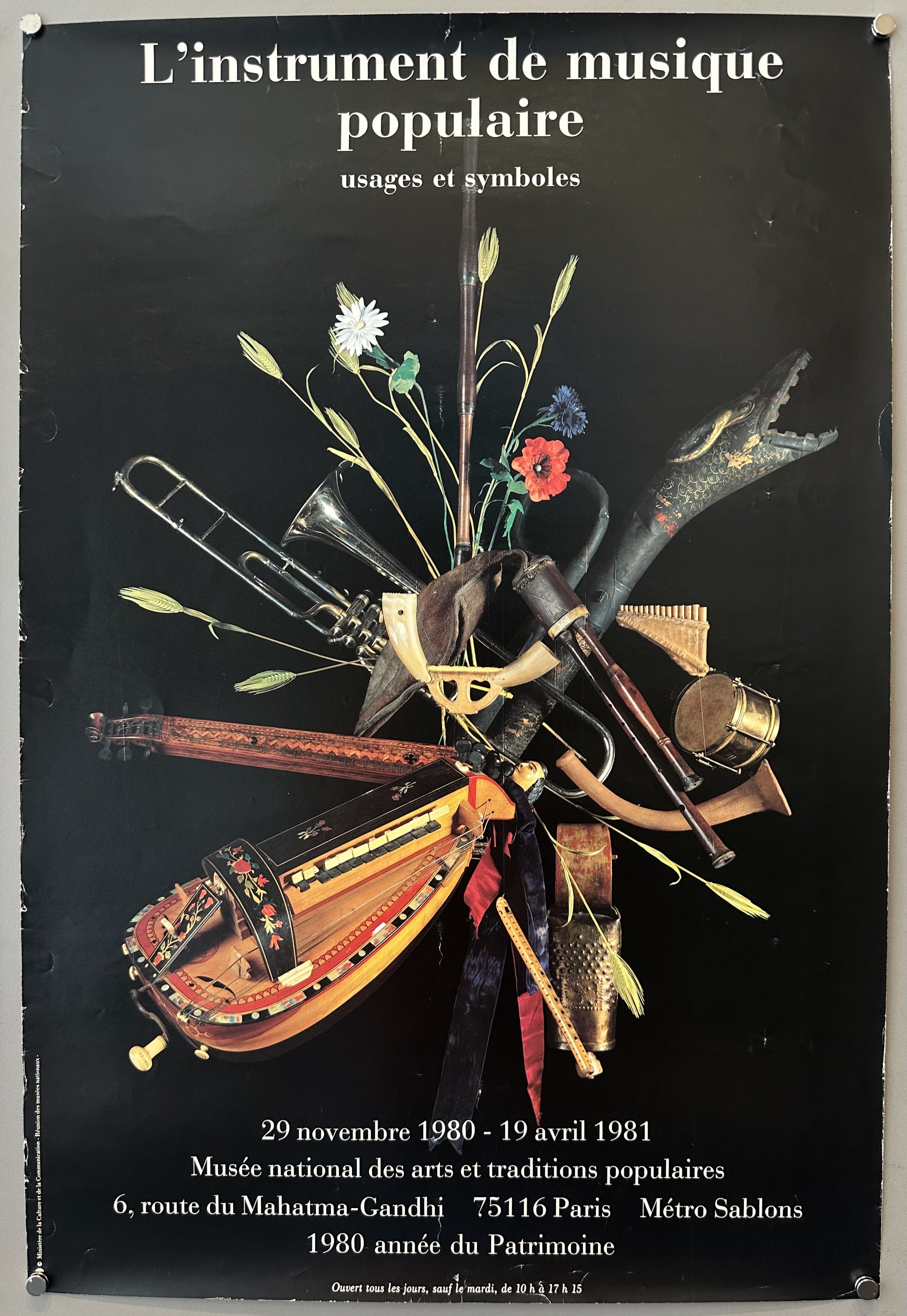 Black background with collage of musical instruments connected together in the middle for instrument exhibition.
